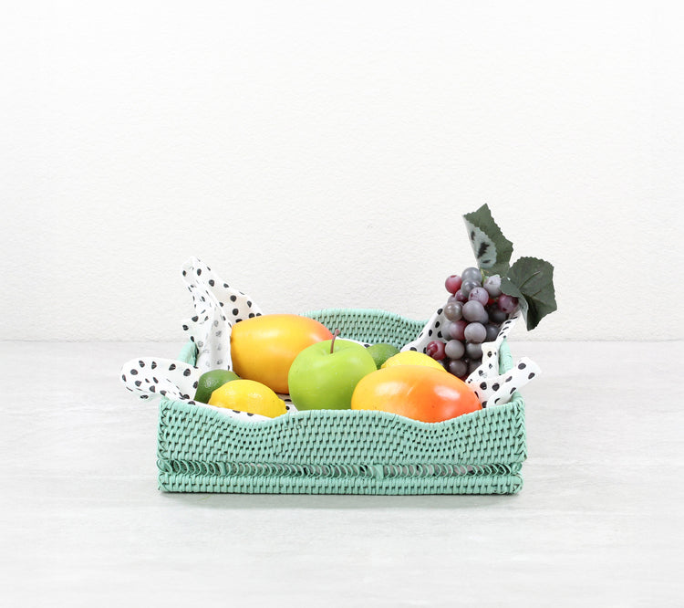 Eco Handcraft square sage green rattan tray holding fruit on countertop – handmade, woven, sustainable decor