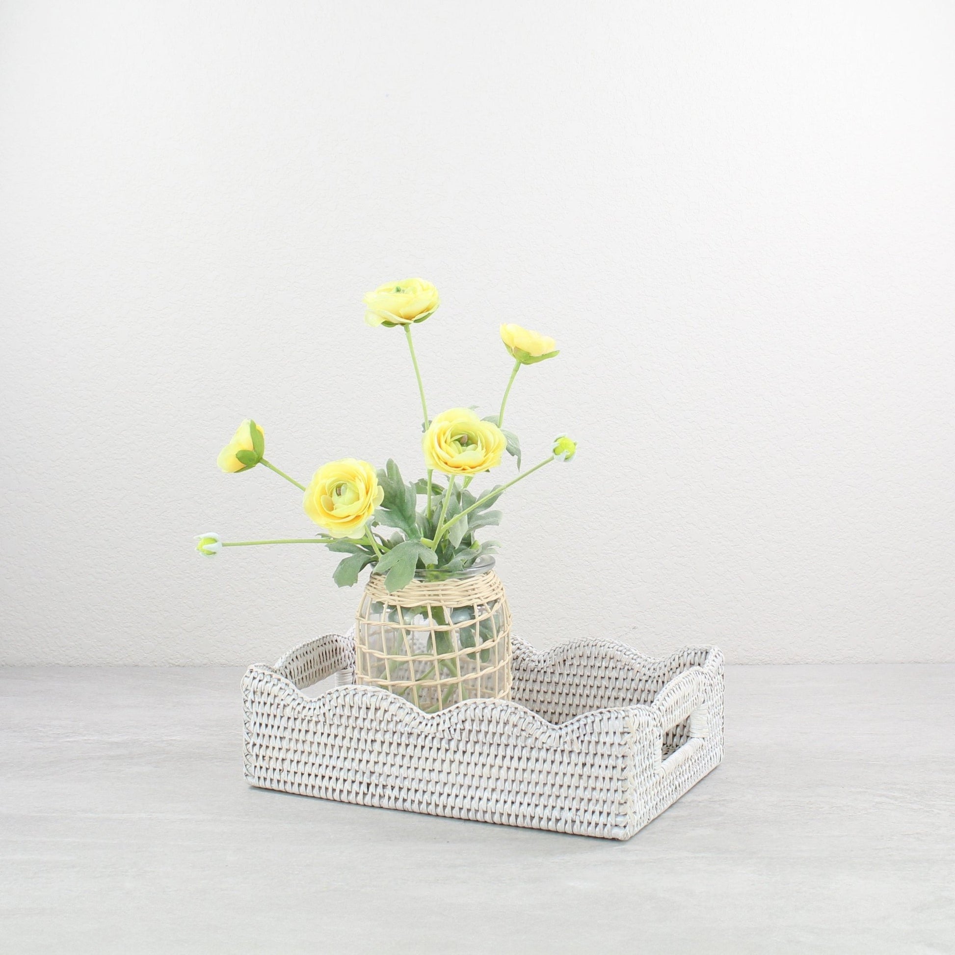 ECO HANDCRAFT whitewashed scalloped rattan tray styled with yellow flowers, ideal for kitchen, vanity, or gifting