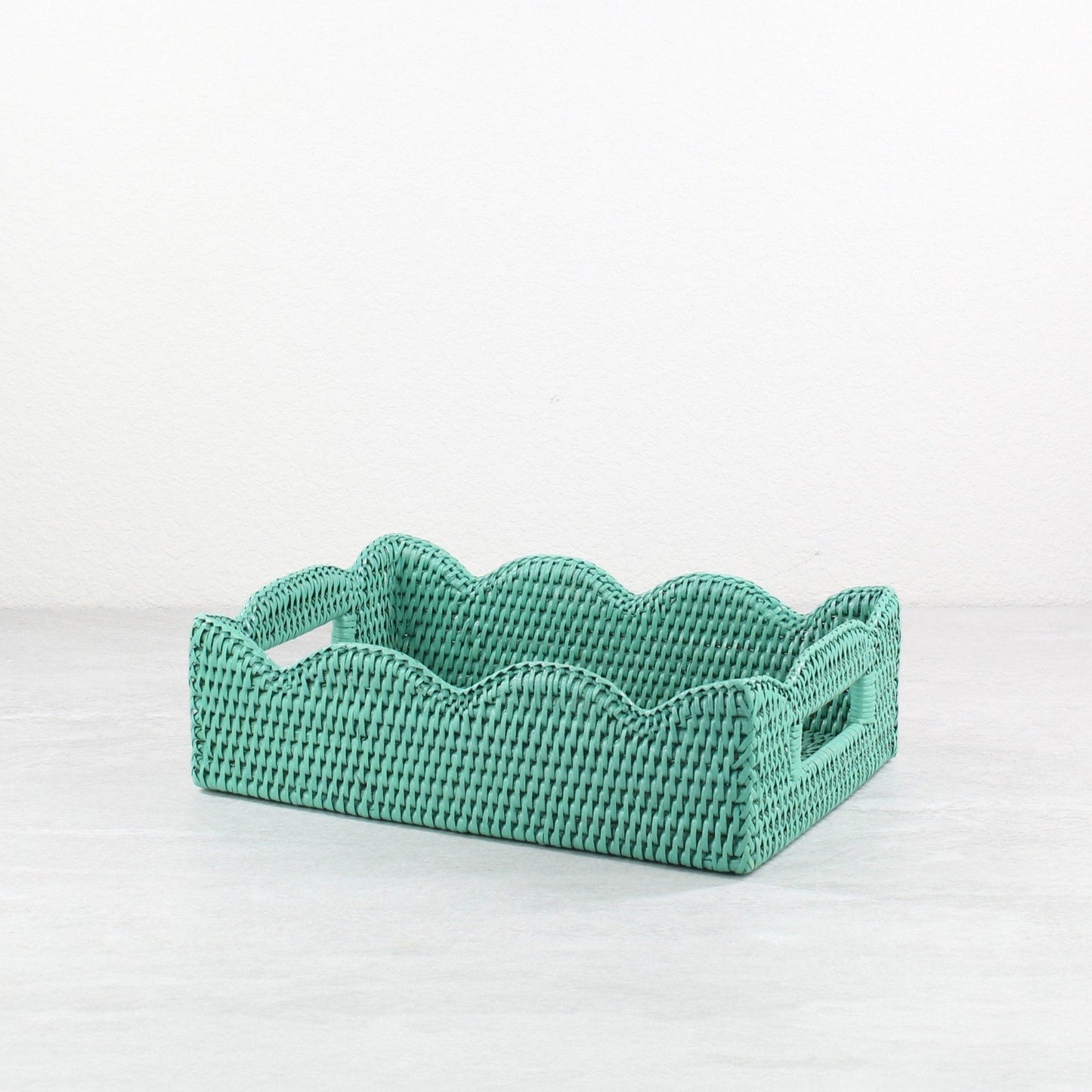 Handwoven turquoise scalloped rattan tray with cutout handles for stylish home storage or serving