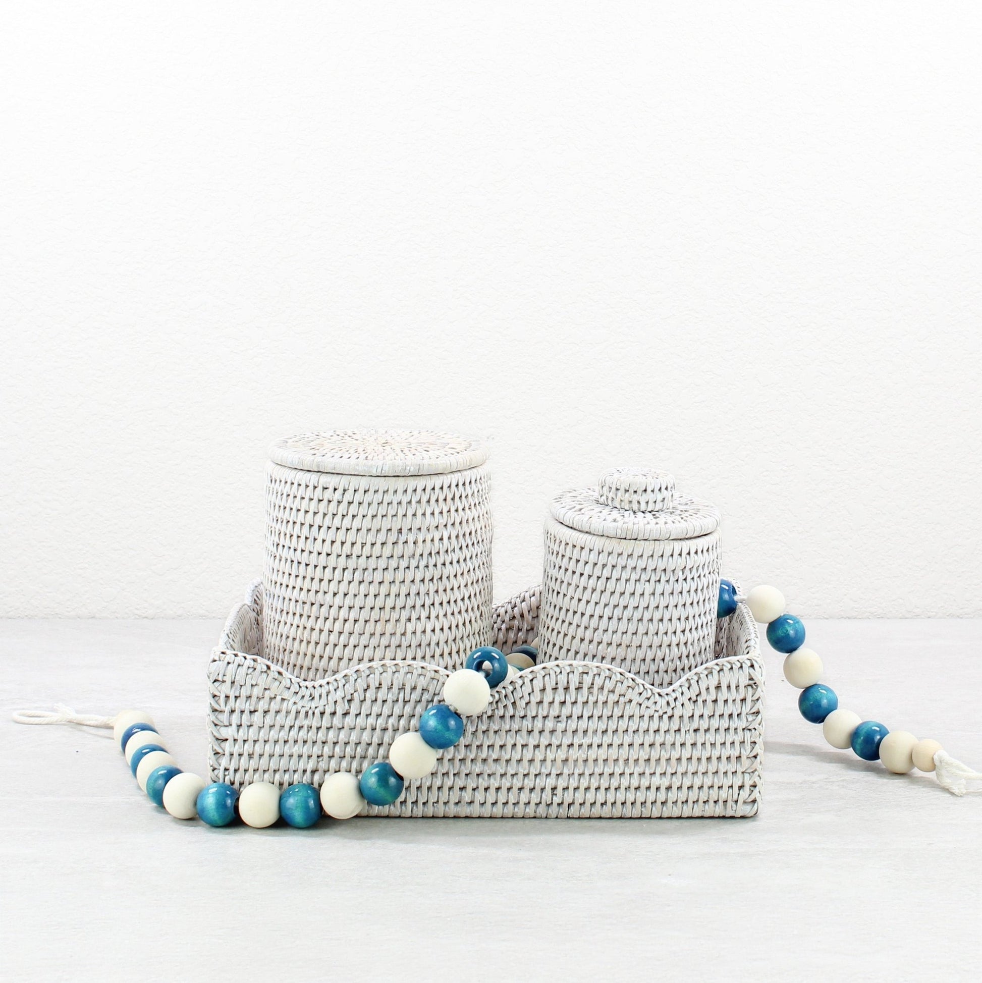Eco Handcraft whitewash rattan tray with matching canisters and blue beads for spa-style vanity styling