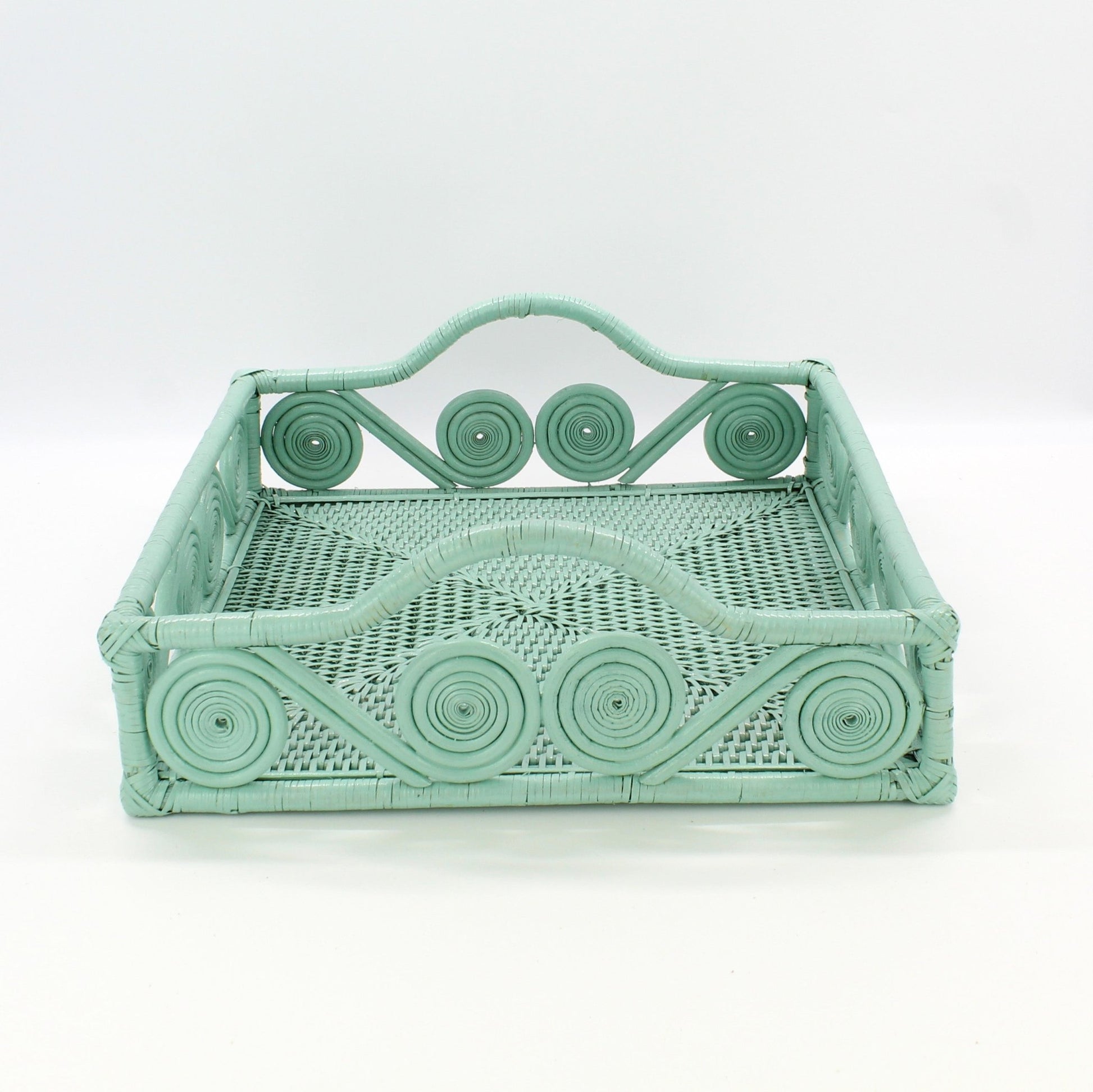 Eco Handcraft sage green swirl rattan tray on a light gray surface for home organization