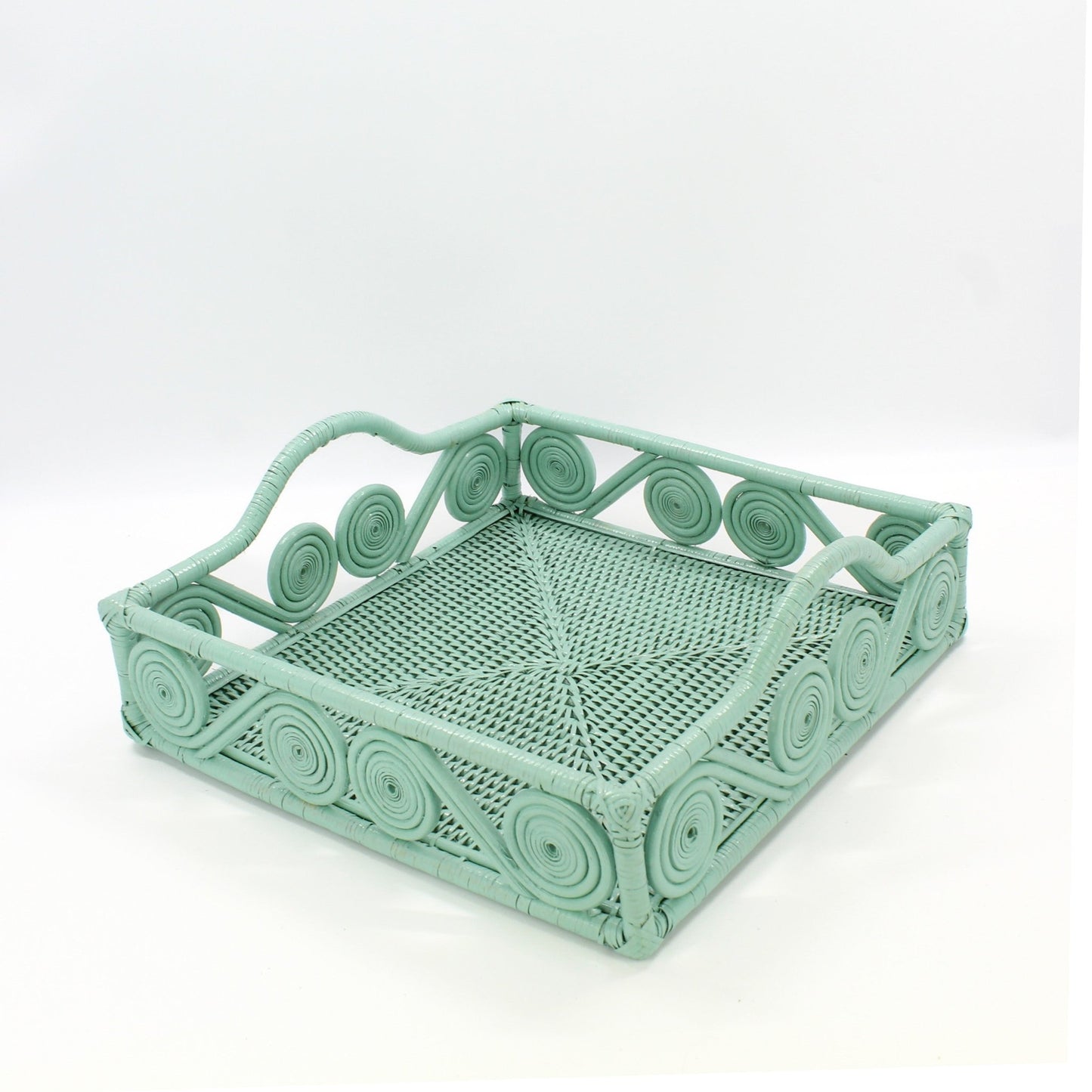 Eco Handcraft sage green swirl rattan tray on a light gray surface, perfect for table setting