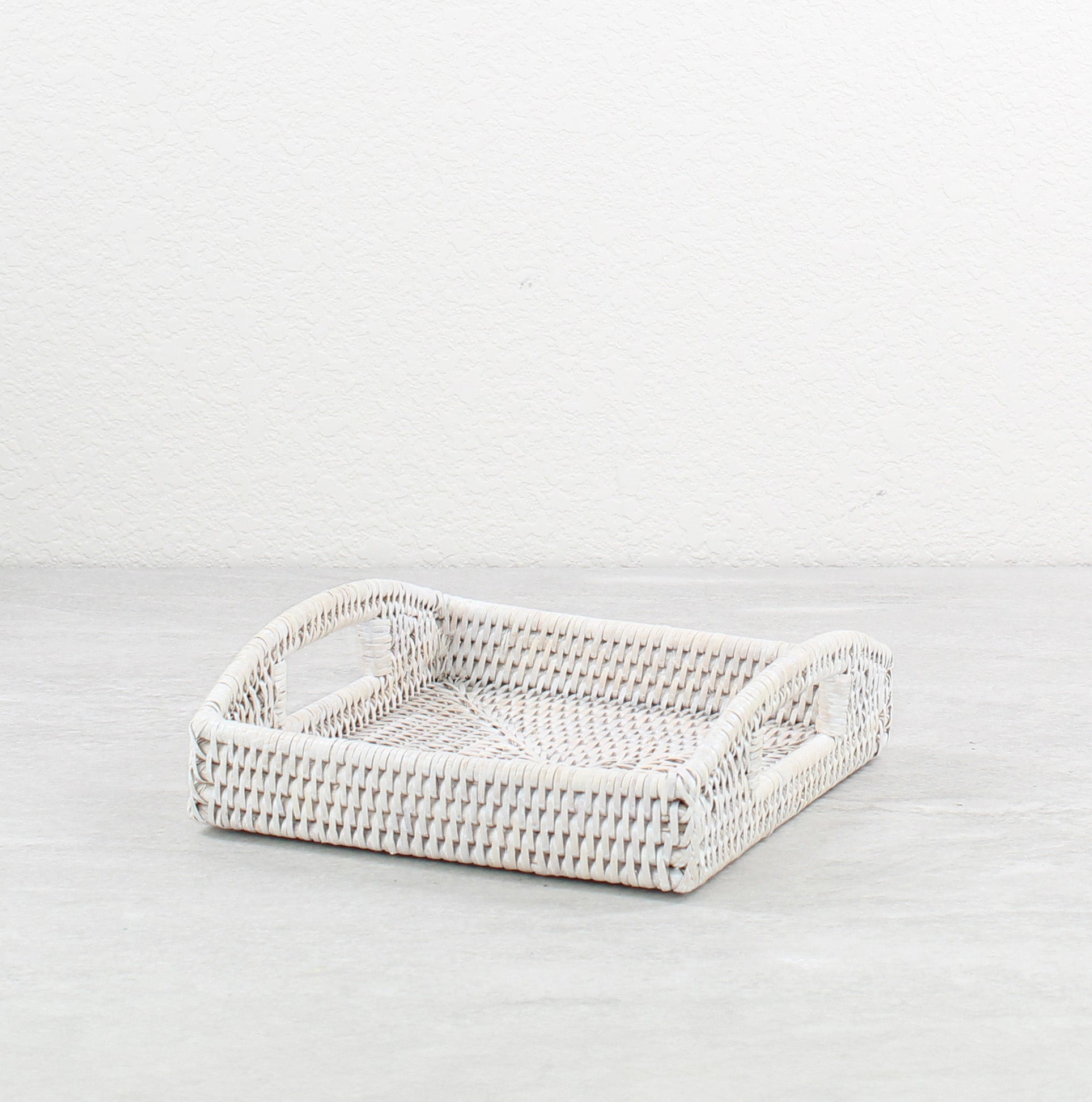 Eco Handcraft whitewash rattan tray, stacked for small item storage and elegant bathroom or bedroom countertop styling