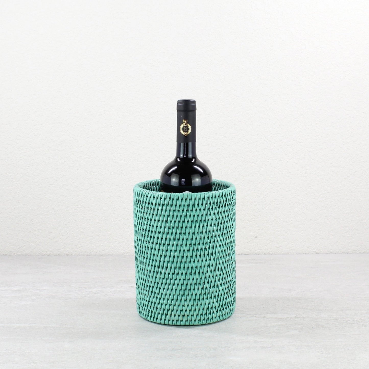 Eco Handcraft turquoise rattan wine bottle holder for coastal entertaining or eco-friendly dining décor