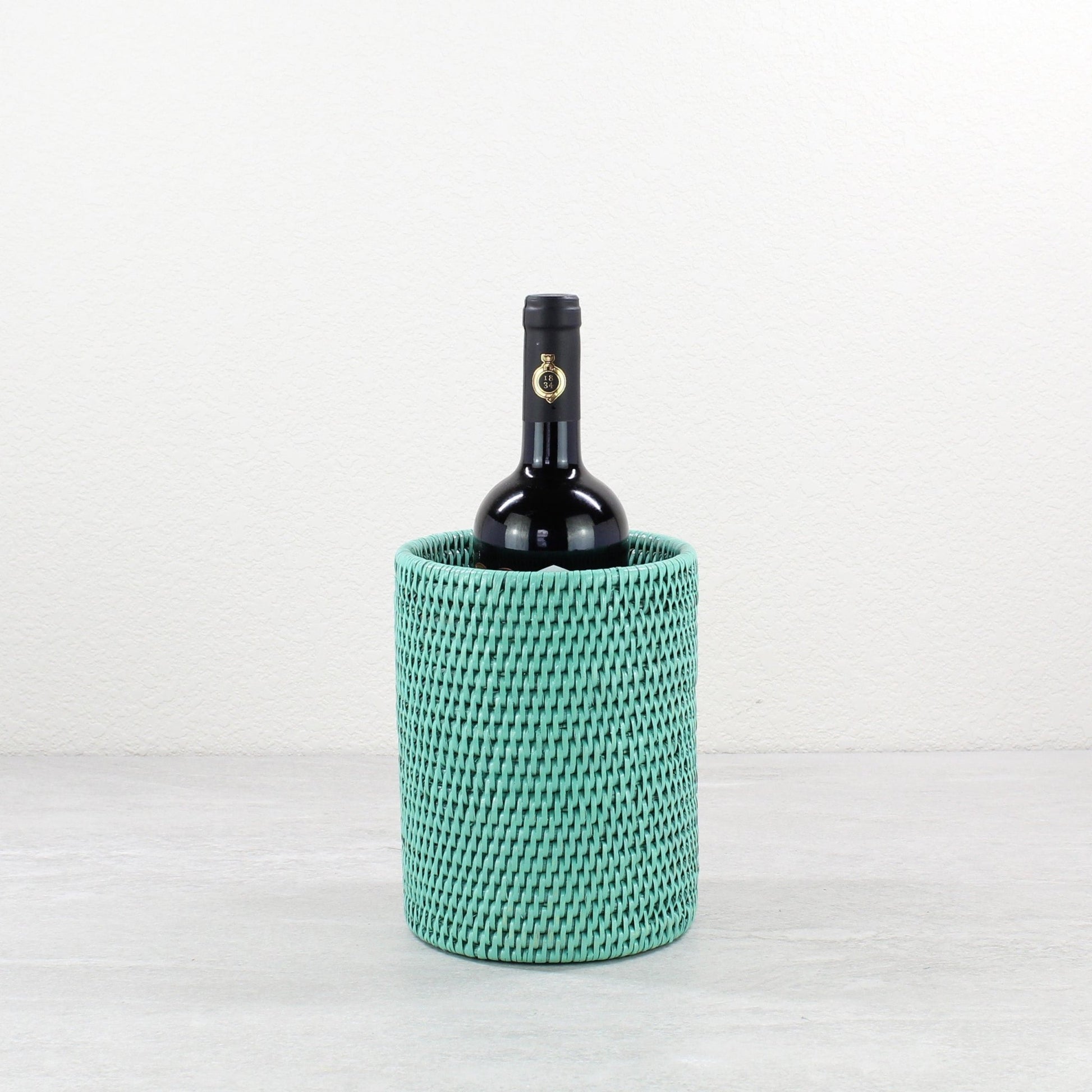 Eco Handcraft turquoise rattan wine bottle holder for coastal entertaining or eco-friendly dining décor