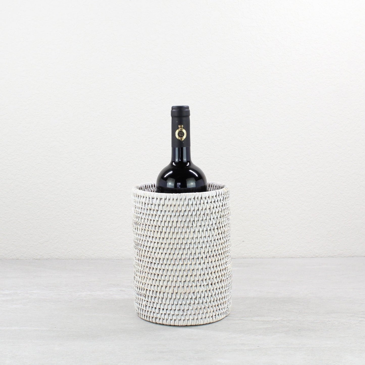 ECO HANDCRAFT whitewashed rattan wine bottle holder, perfect for rustic entertaining, gifting, or elegant bar styling