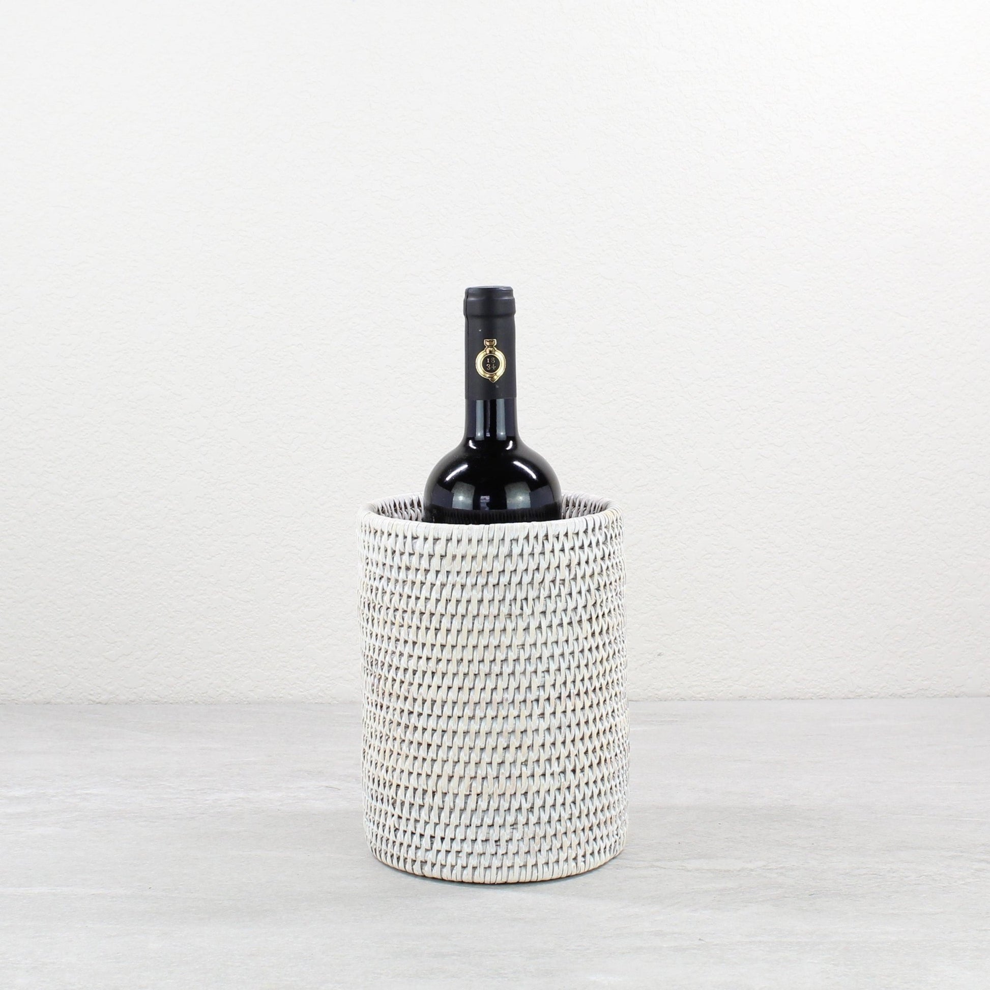 ECO HANDCRAFT whitewashed rattan wine bottle holder, perfect for rustic entertaining, gifting, or elegant bar styling