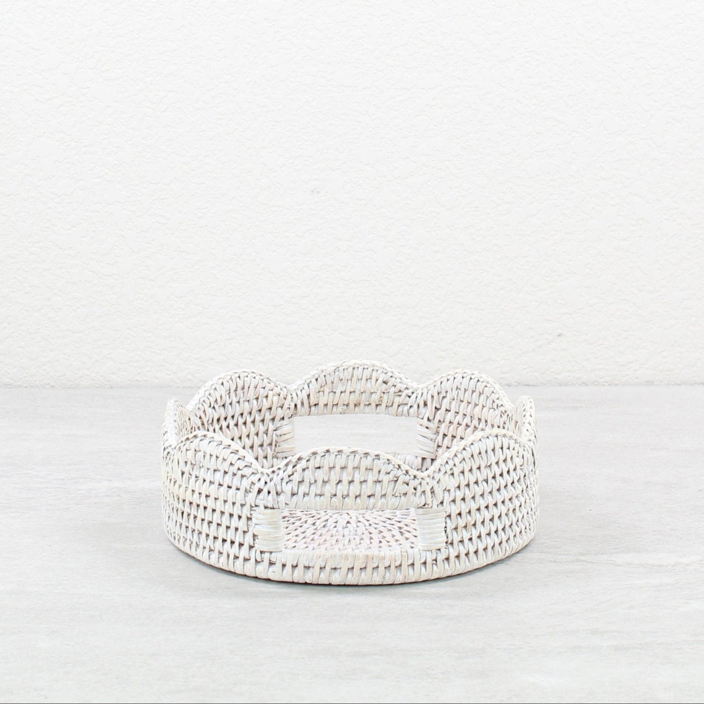ECO HANDCRAFT whitewashed round scalloped rattan tray with cutout handles for serving snacks or storing accessories