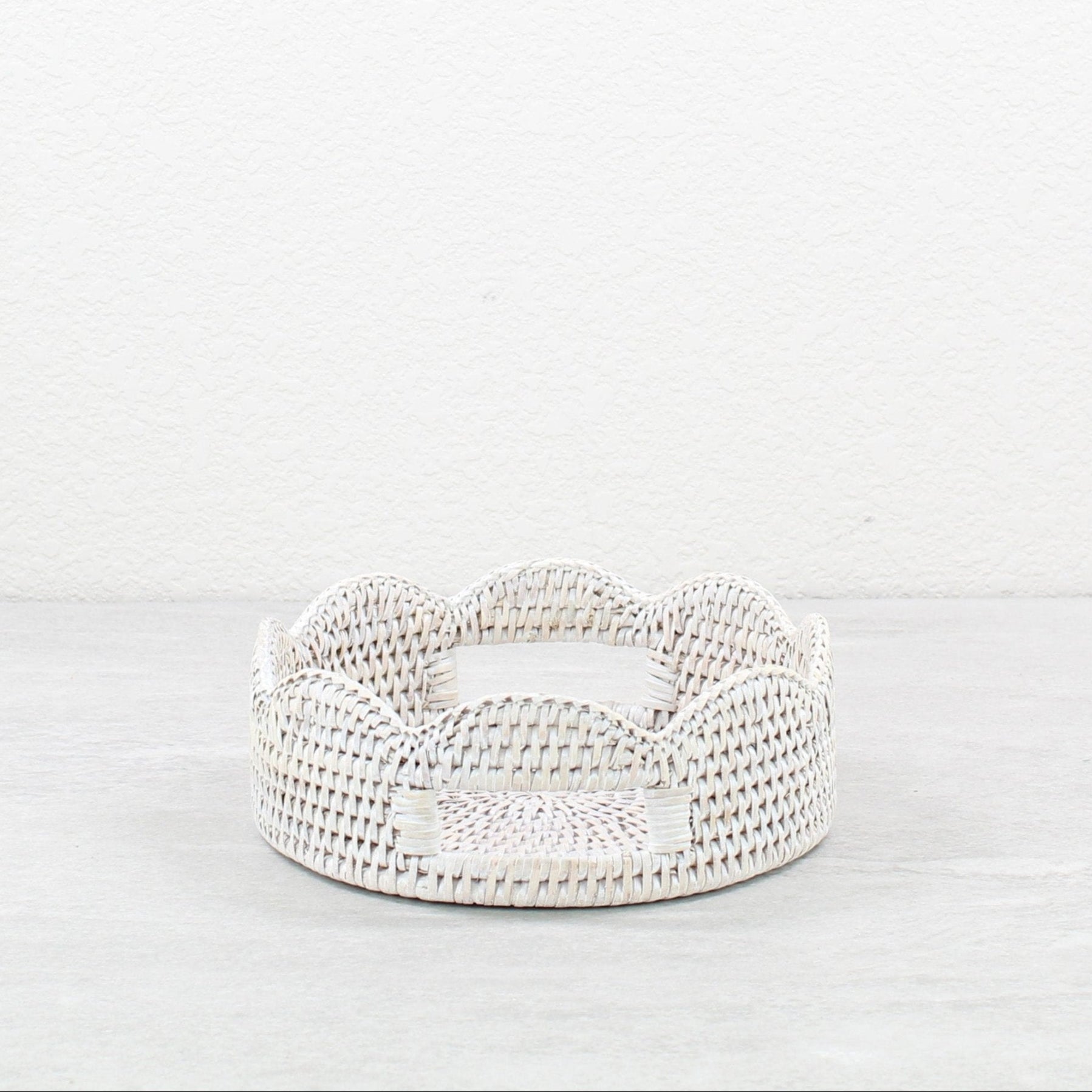 ECO HANDCRAFT whitewashed round scalloped rattan tray with cutout handles for serving snacks or storing accessories
