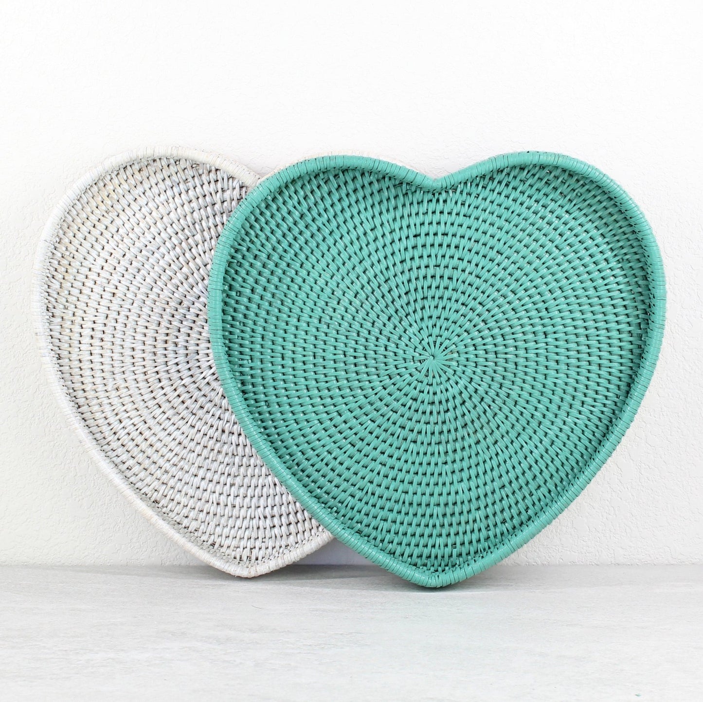 Handmade heart-shaped rattan trays in turquoise and white—ideal for romantic serving, gifting, or cozy decor accents.