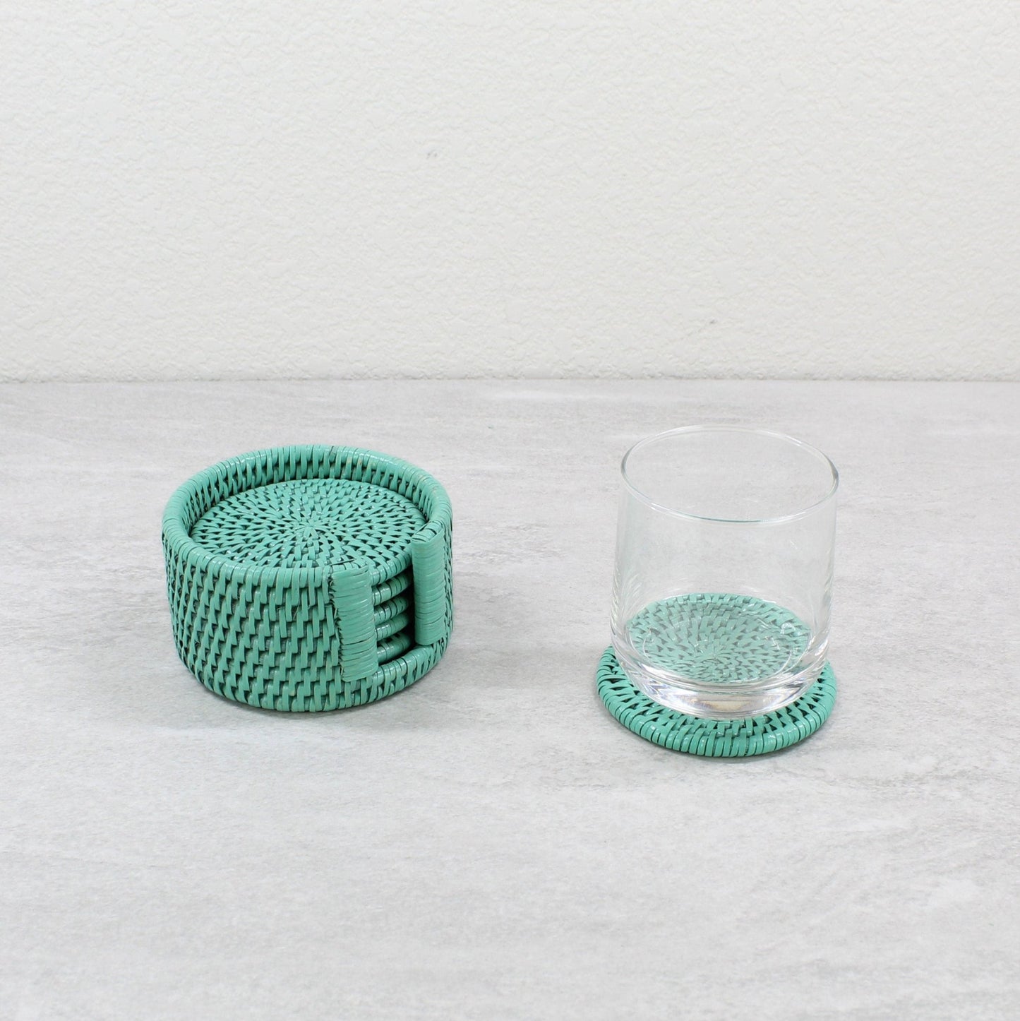 Eco Handcraft turquoise rattan round coaster set with holder and glass, perfect for stylish drink protection