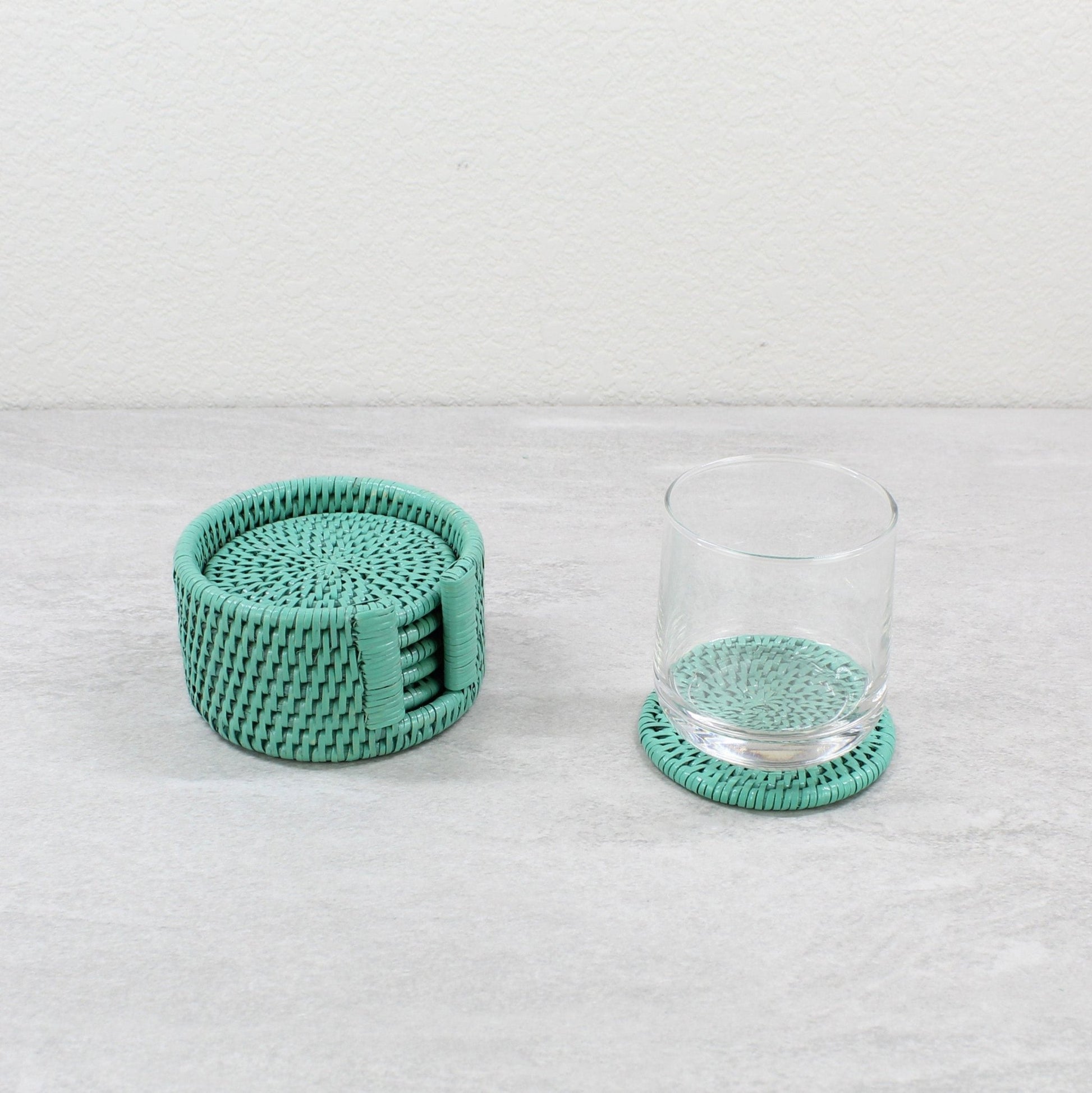 Eco Handcraft turquoise rattan round coaster set with holder and glass, perfect for stylish drink protection