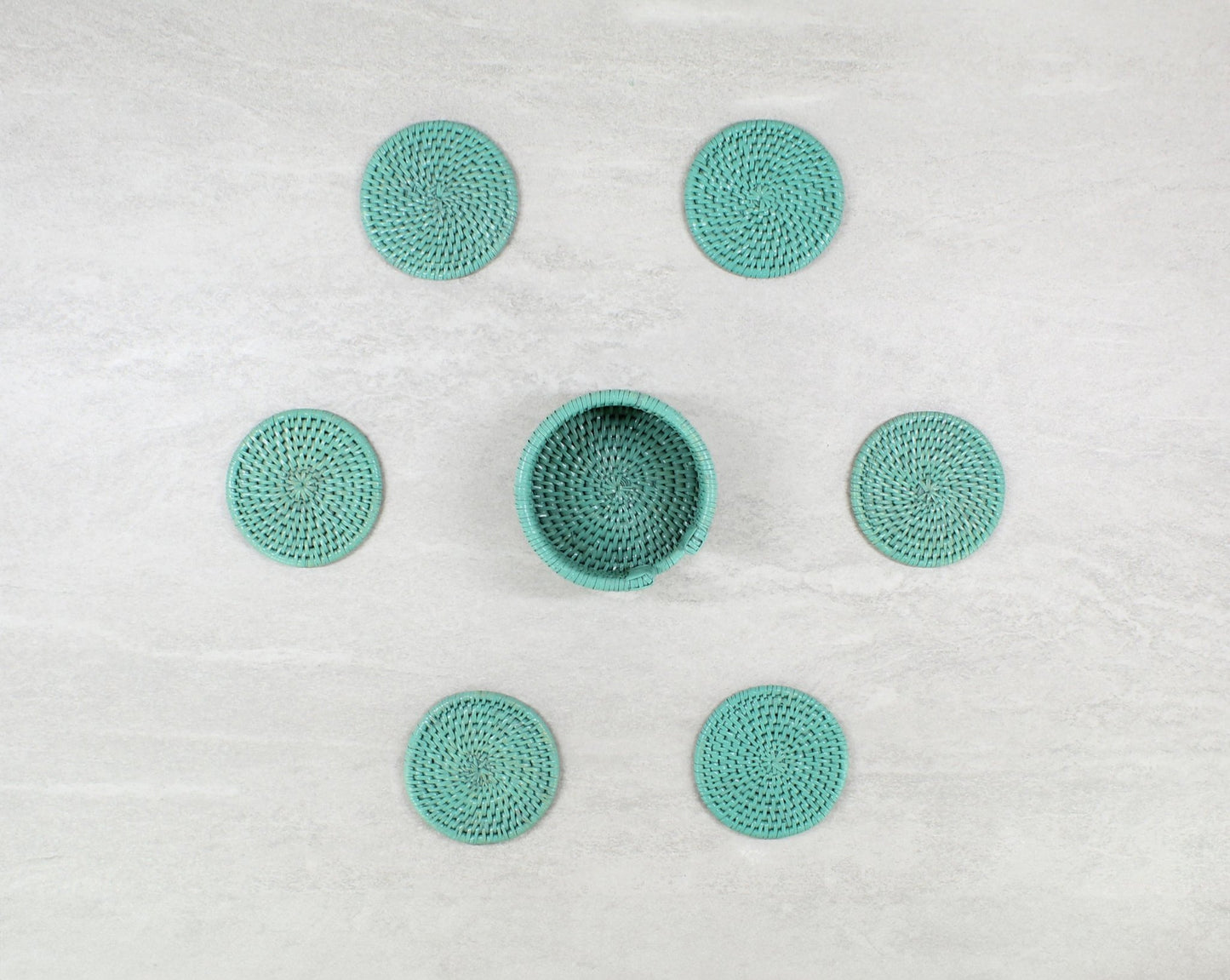Eco Handcraft turquoise rattan round coaster set with holder, perfect for protecting tables with natural charm