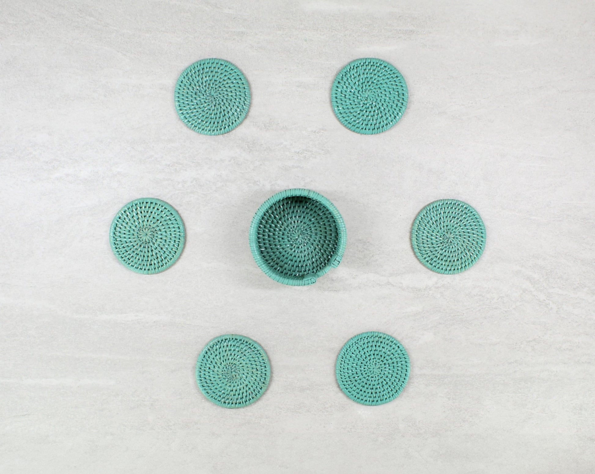 Eco Handcraft turquoise rattan round coaster set with holder, perfect for protecting tables with natural charm