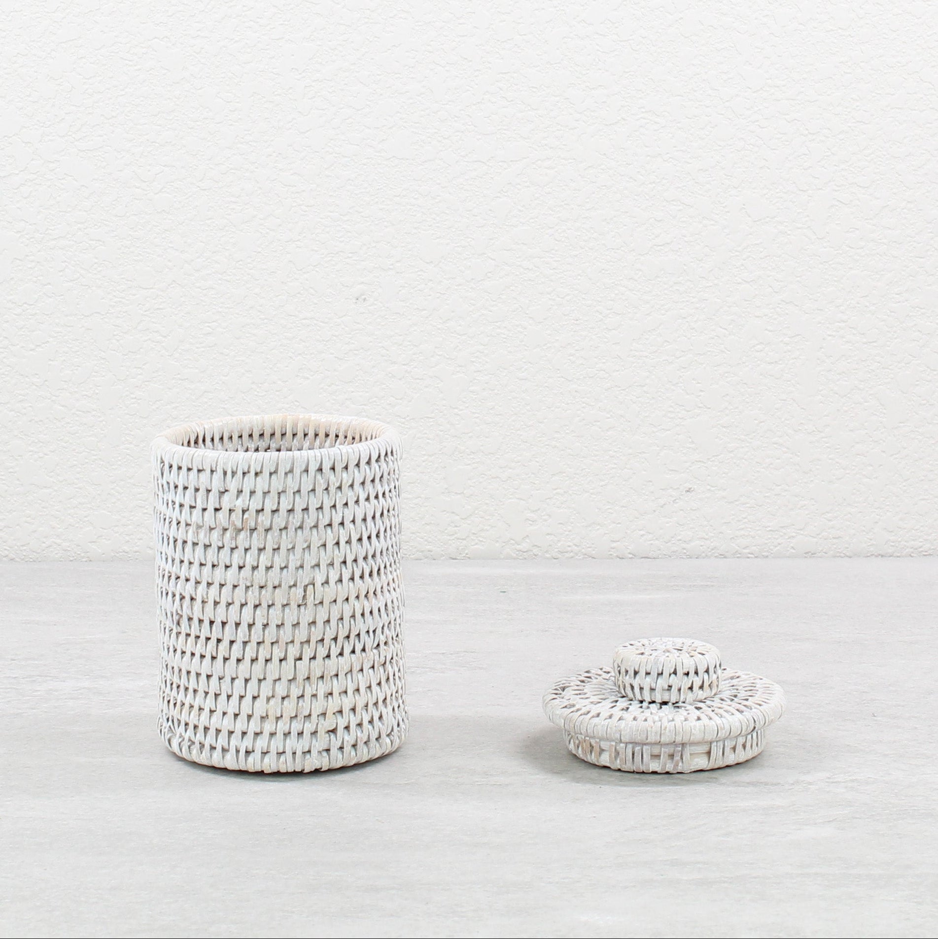 Eco Handcraft whitewash rattan canister with lid, perfect for storing cotton pads on vanity or shelf