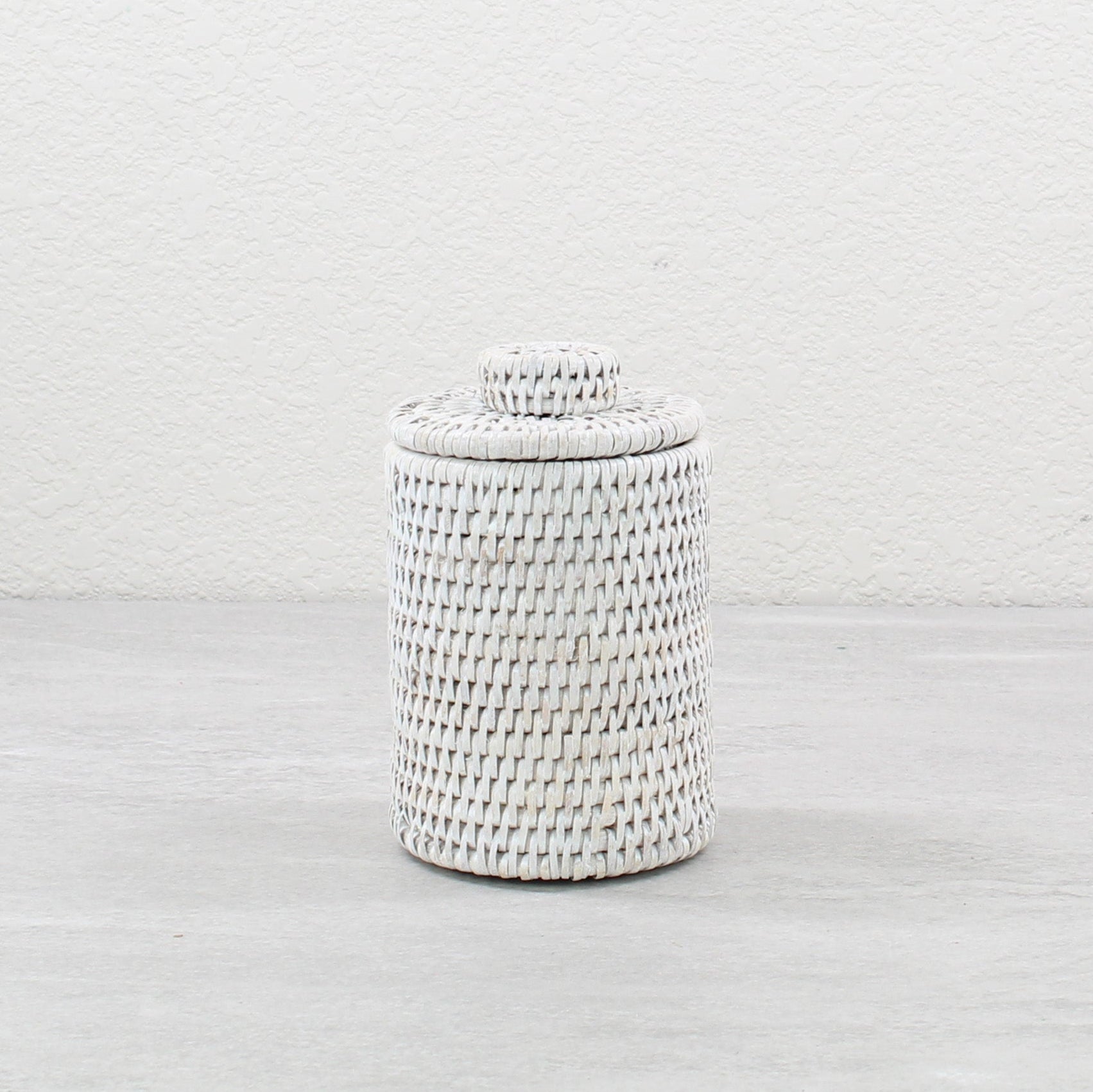Eco Handcraft whitewash rattan canister with lid, perfect for storing cotton pads or makeup brushes on vanity or shelf