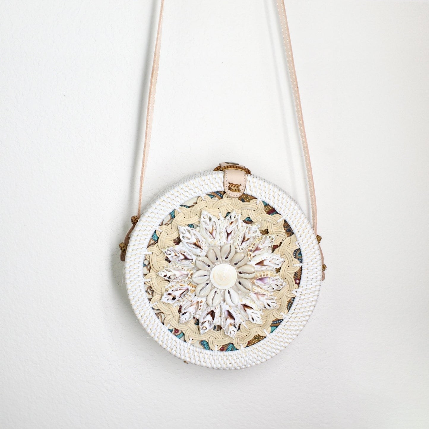 Body part of Bali-style round rattan crossbody bag with seashell flower design