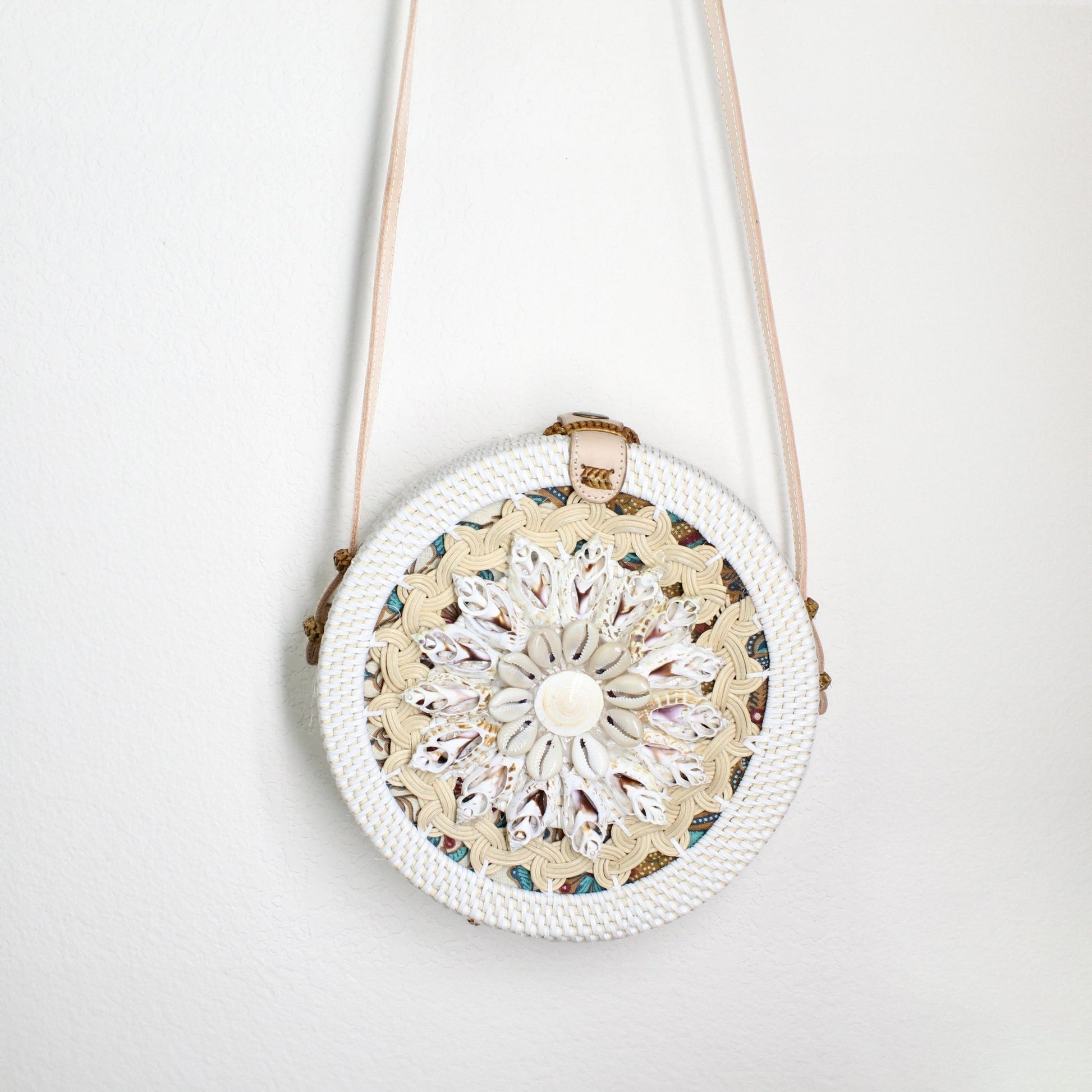 Body part of Bali-style round rattan crossbody bag with seashell flower design