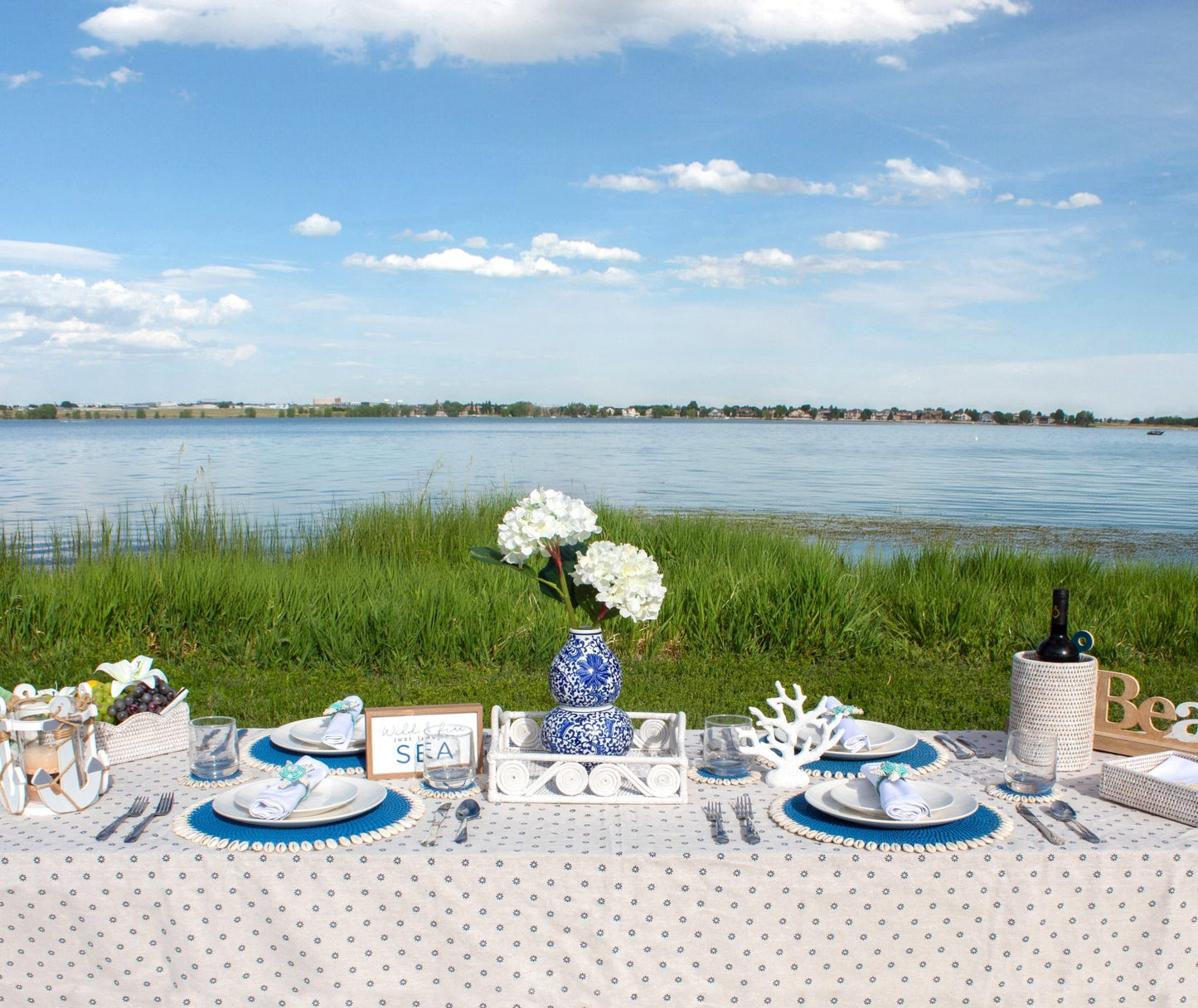 Eco Handcraft rattan coastal tablescape by the lake – handmade decor with white tray, coral, shells, and florals