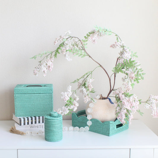 Eco Handcraft turquoise rattan tissue box, canister, and tray styled with florals for elegant U.S. home décor inspiration
