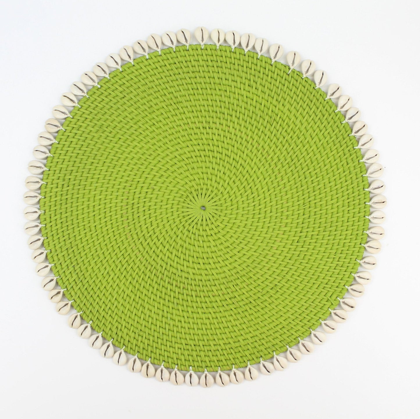 Handwoven lime green round rattan placemat with seashell trim, perfect for coastal dining and eco-friendly table styling.