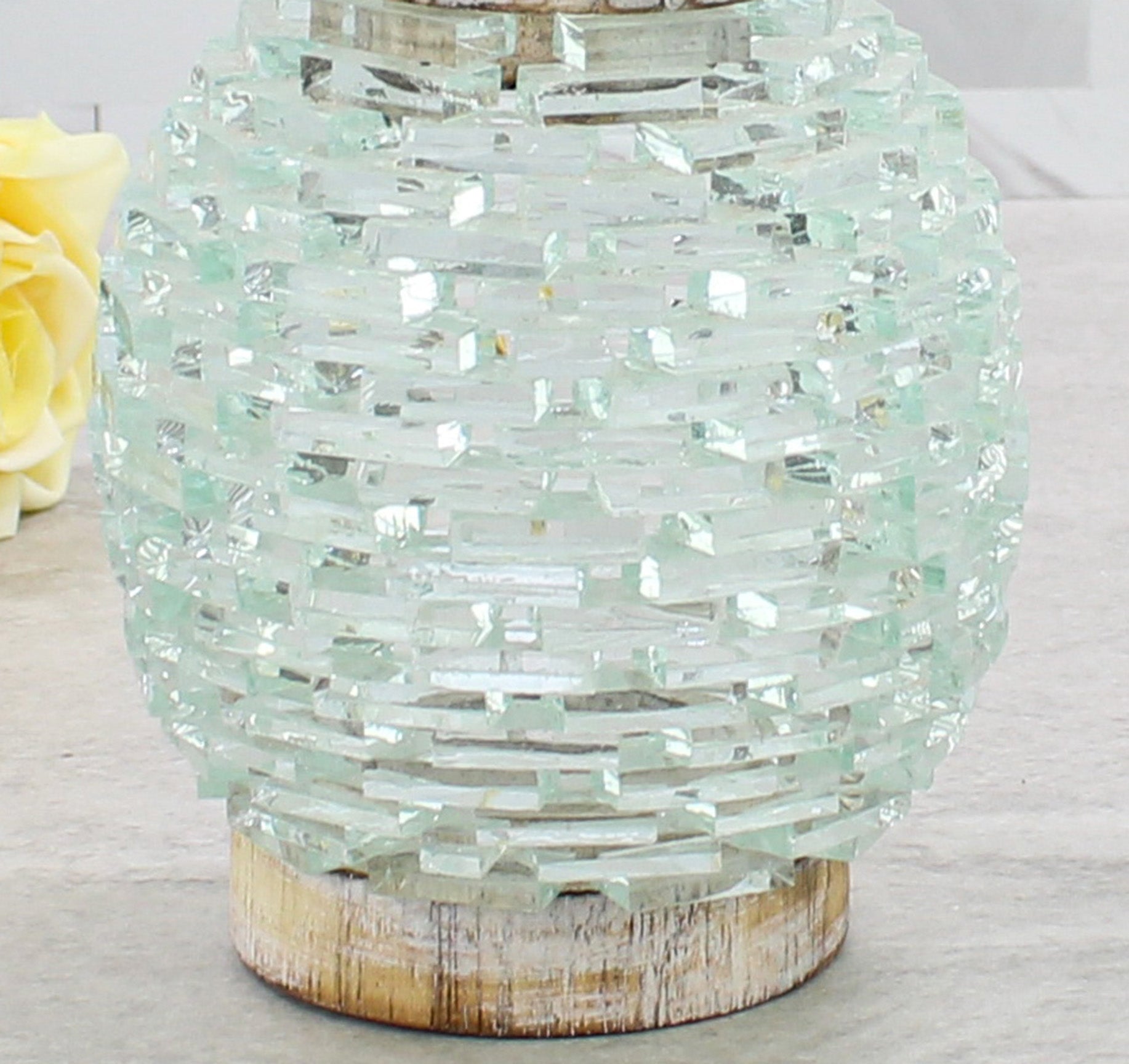 Detailed close-up of the textured glass pattern on the handmade pineapple tea light holder showing shimmering layered glass artistry.