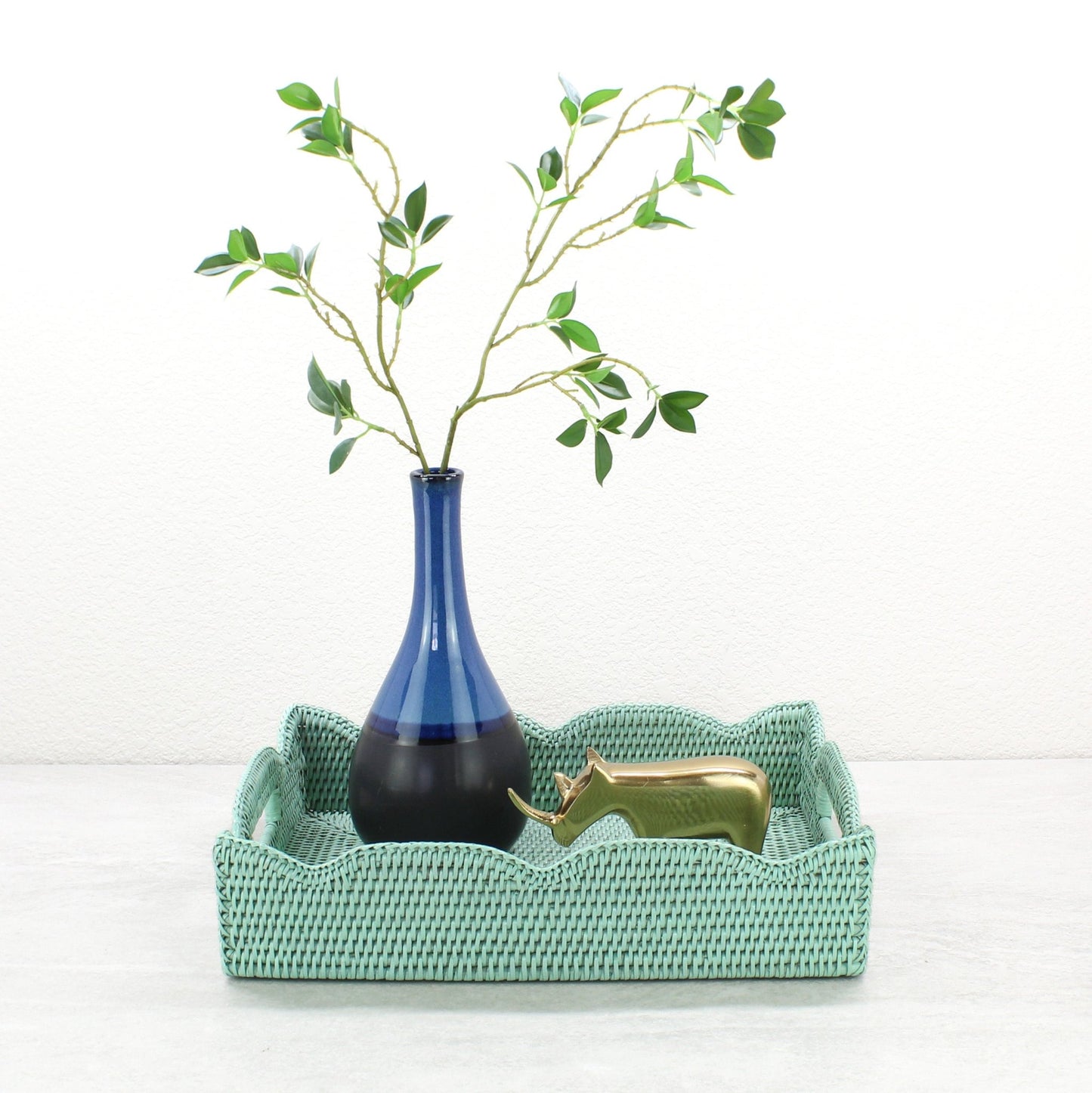 Handwoven medium scalloped edge rectangle rattan tray in sage leaf green, ideal for serving and organizing