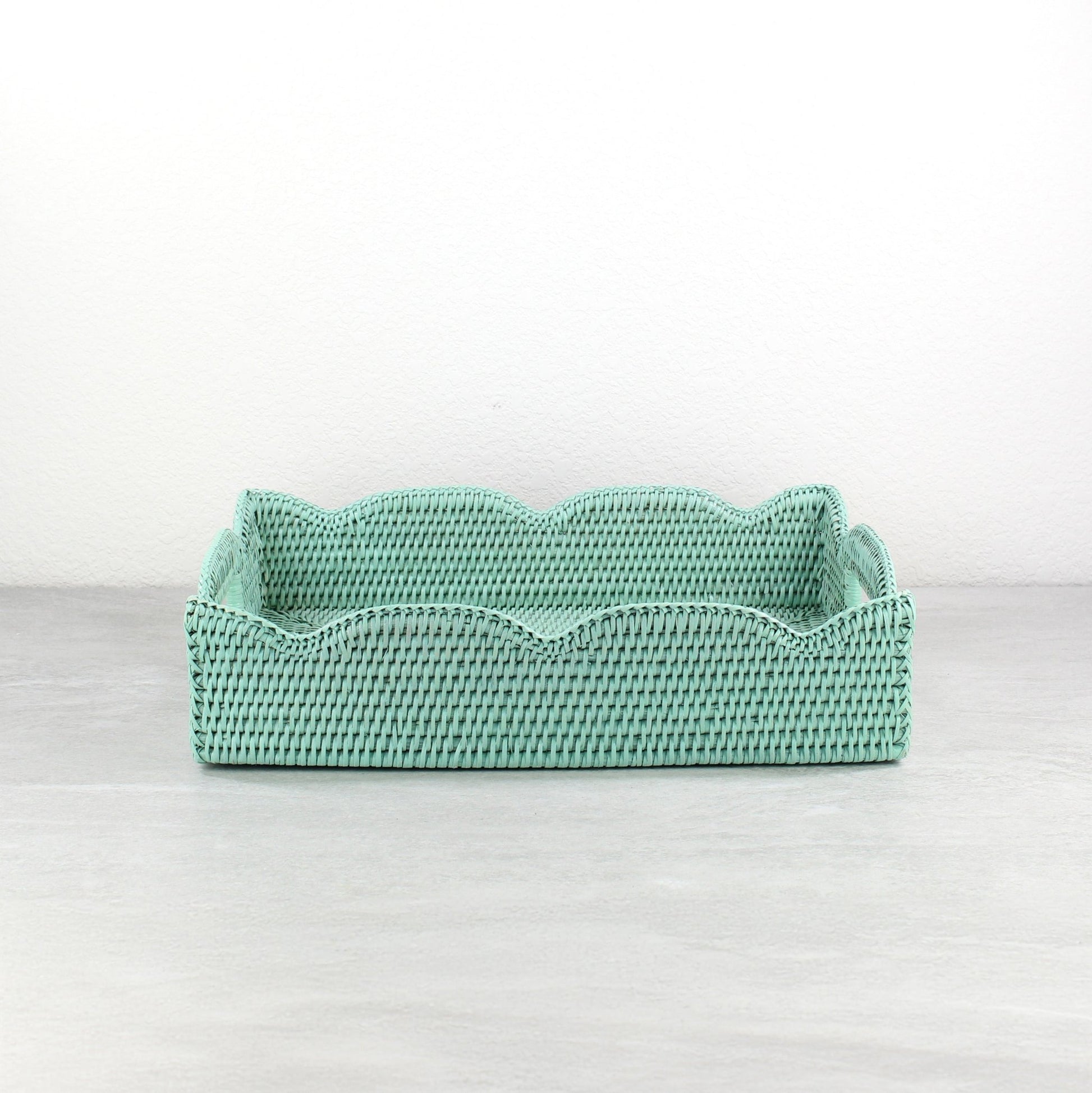 Handwoven scalloped edge medium rectangle rattan tray in sage leaf green, ideal for serving, modern decorating, and organizing.