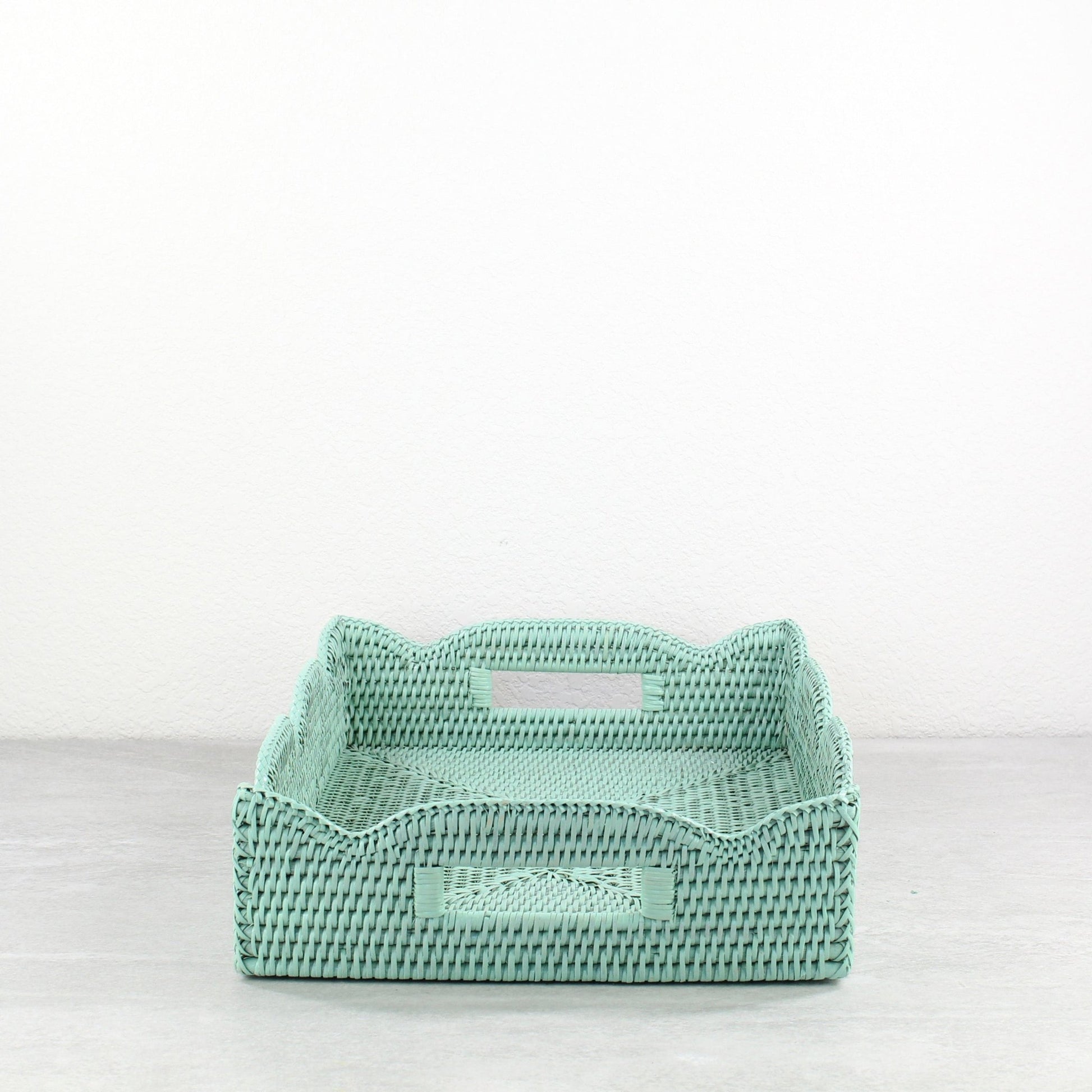 Sage Leaf Green scalloped rattan tray with wave edge design and handles, displayed in front view.