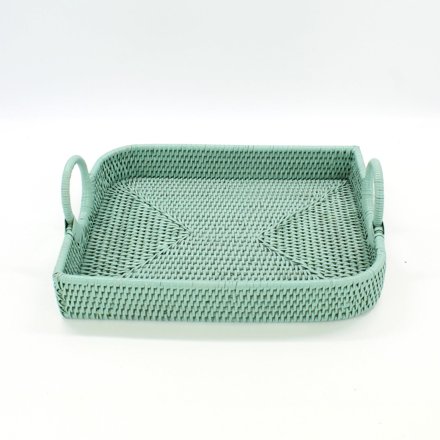 Sage Leaf green handwoven rattan tray with handles on a white background