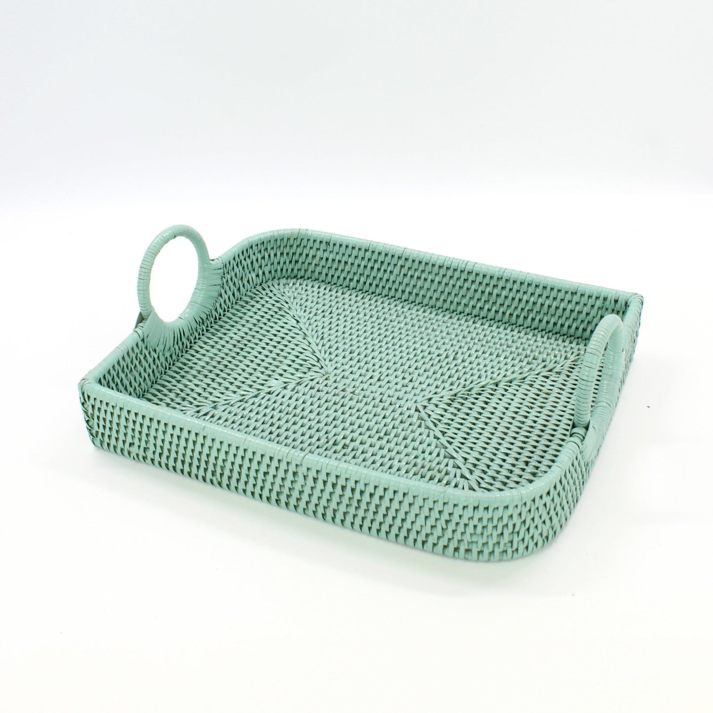 Sage Leaf green handwoven rattan tray with handles on a white background from Side View