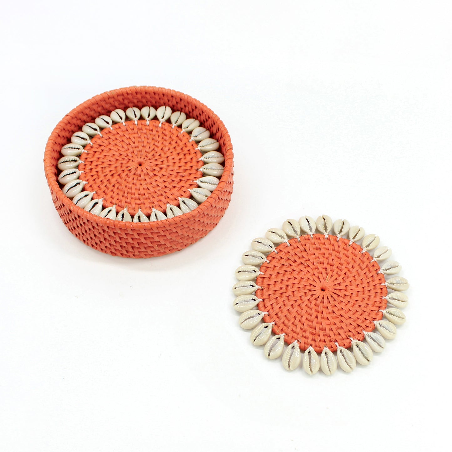 Set of orange rattan coasters with natural seashell trim and matching holder, artisan handmade eco-friendly tableware
