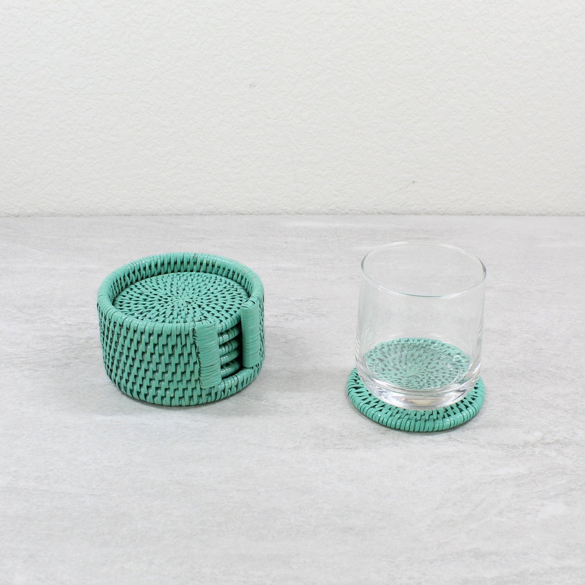 Handwoven turquoise rattan coaster set with holder and glass by ECO HANDCRAFT, ideal for eco-conscious homes.