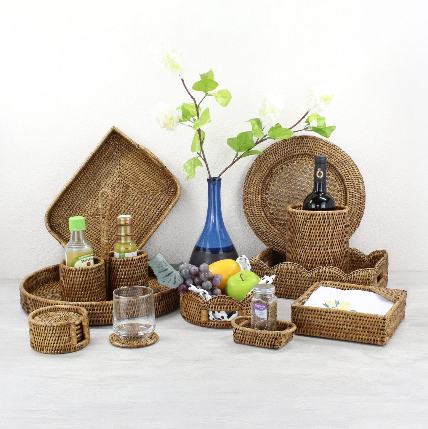ECO HANDCRAFT brown rattan kitchen and dining decor set with wine holder, trays, baskets, and accessories.