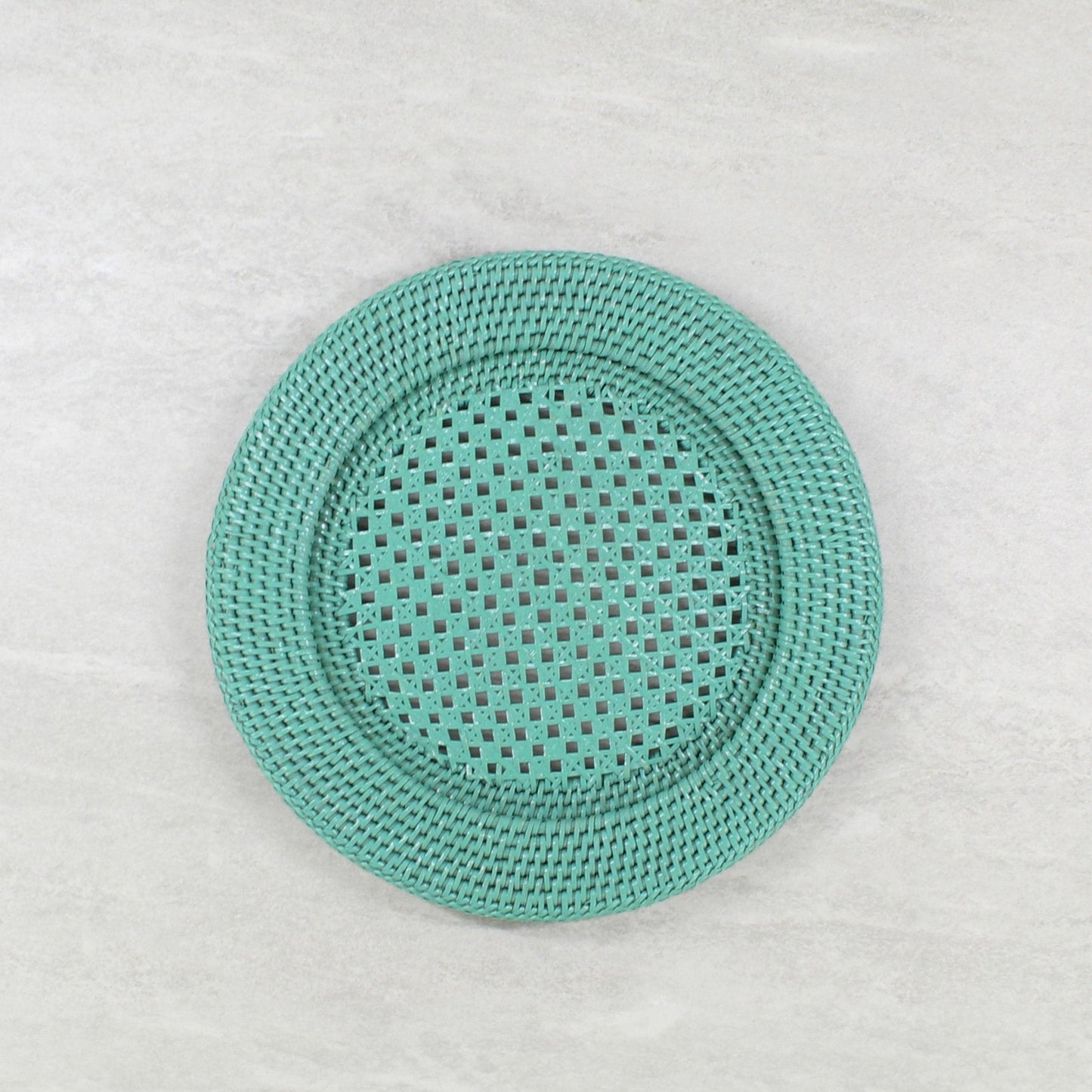 Handcrafted turquoise open-weave rattan charger plate by ECO HANDCRAFT for elegant eco-conscious dining.
