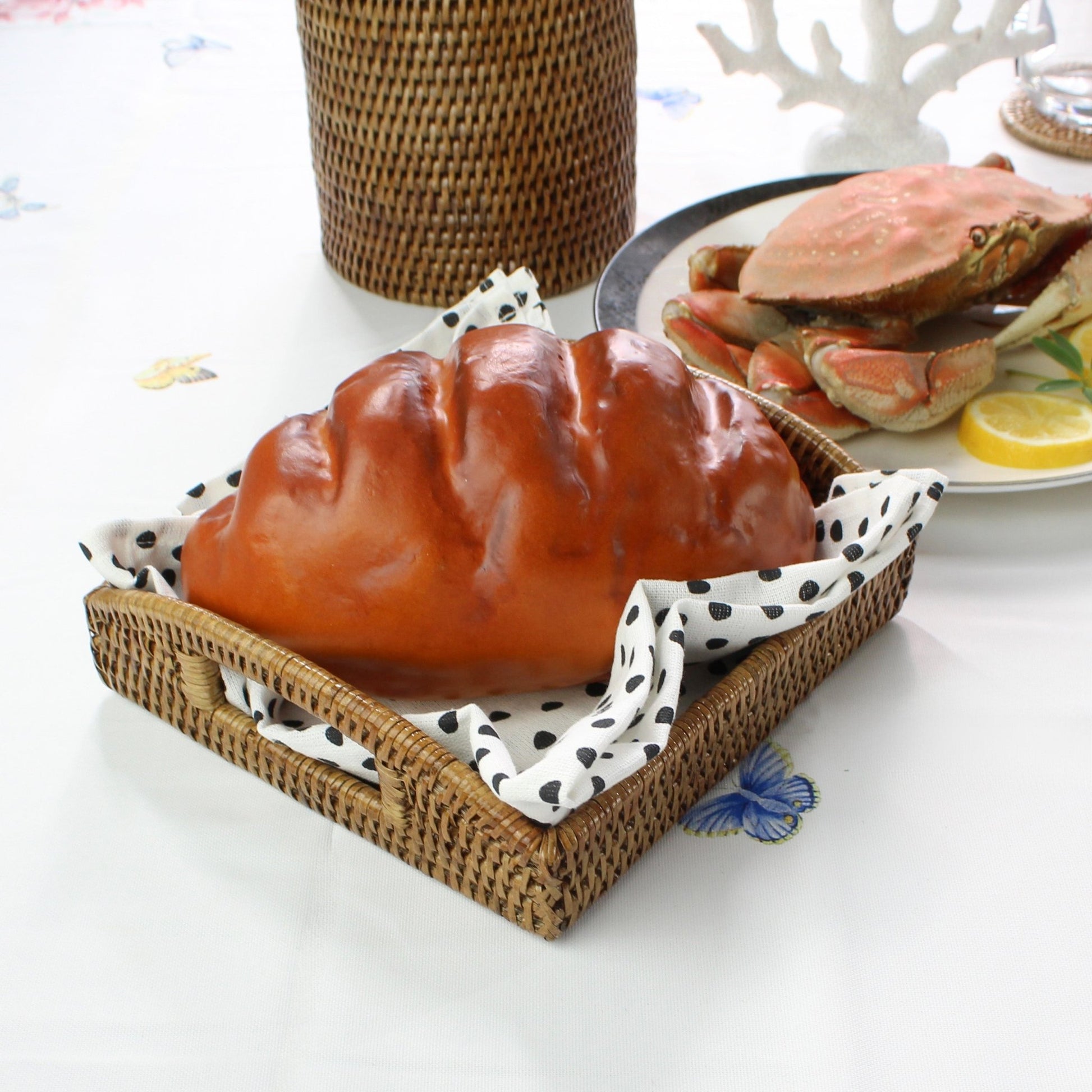 ECO HANDCRAFT small square rattan basket with handle, styled with bread and cloth liner for rustic dining charm