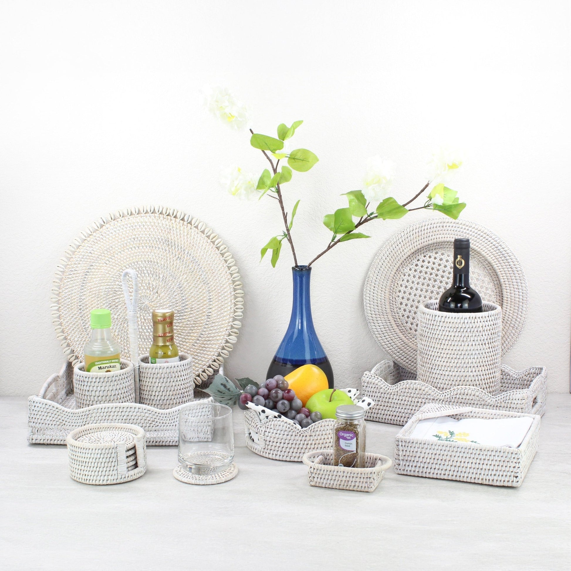 ECO HANDCRAFT whitewashed rattan dining set with trays, coasters, and canisters styled for elegant natural entertaining