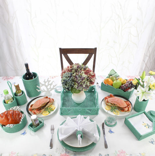Eco Handcraft turquoise rattan dining table decor with crab plates, flower centerpiece, and woven organizers