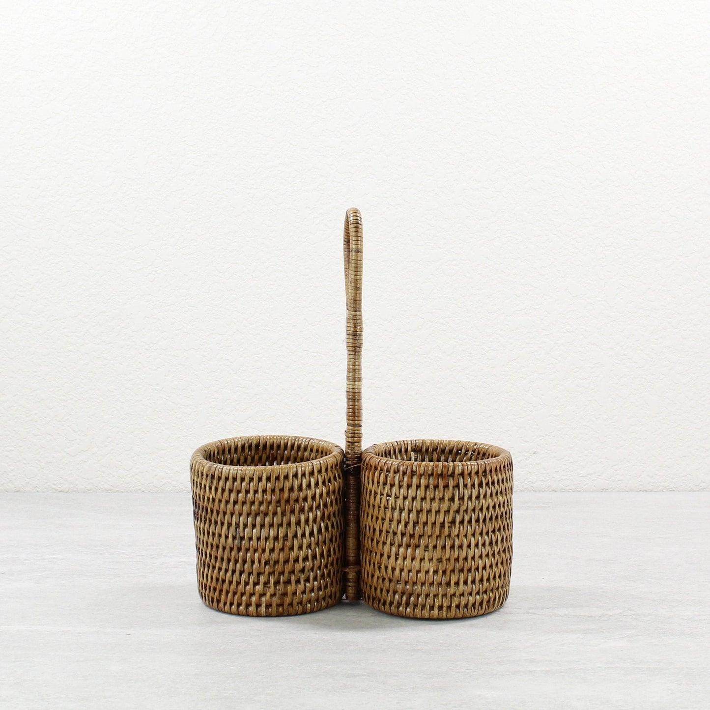 ECO HANDCRAFT brown rattan double condiment holder with handle, perfect for sauces, spices, or dining essentials.