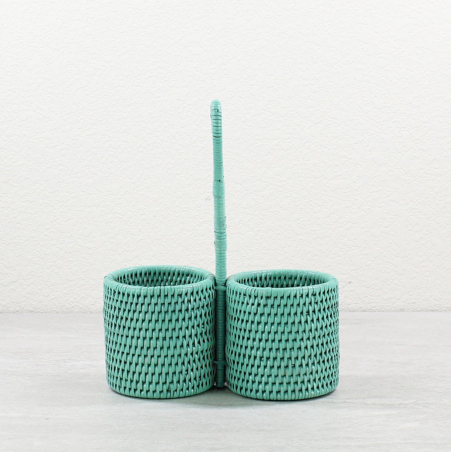 ECO HANDCRAFT turquoise rattan double condiment holder with handle for sauces, oils, or utensils.
