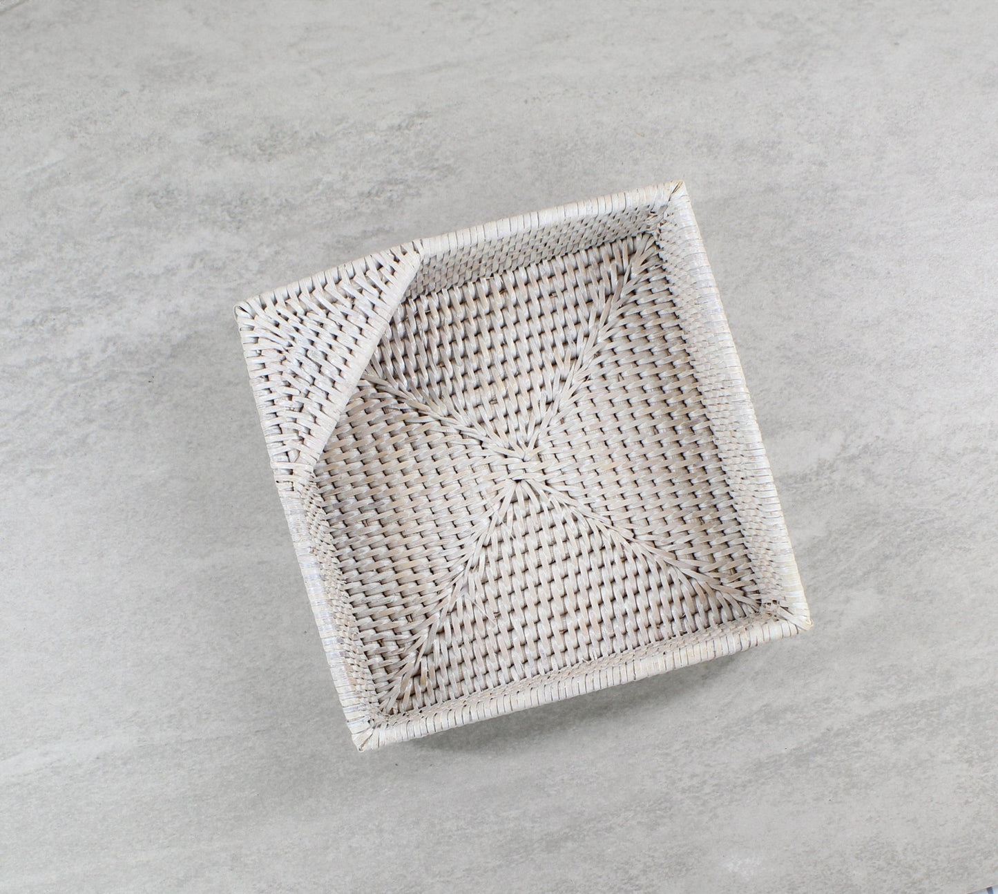 Whitewash rattan napkin holder with fine weaving.