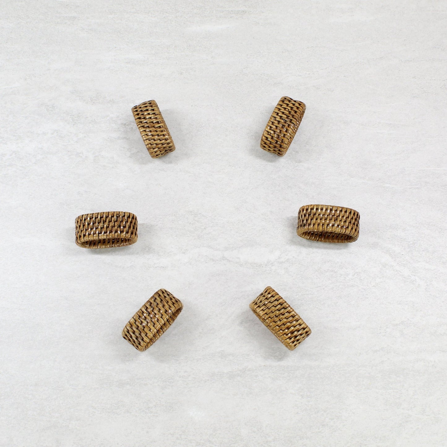 Set of six Eco Handcraft tight woven oval rattan napkin rings, honey brown finish, handmade boho coastal dining table décor