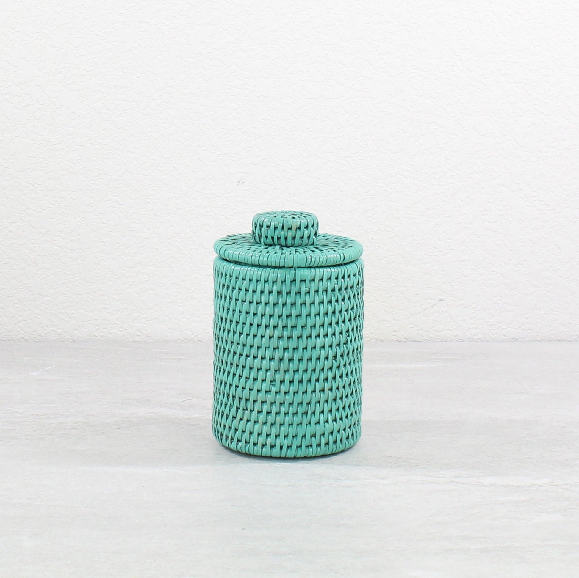 Eco Handcraft turquoise rattan canister with lid for storing small bathroom items, cotton pads, or countertop display