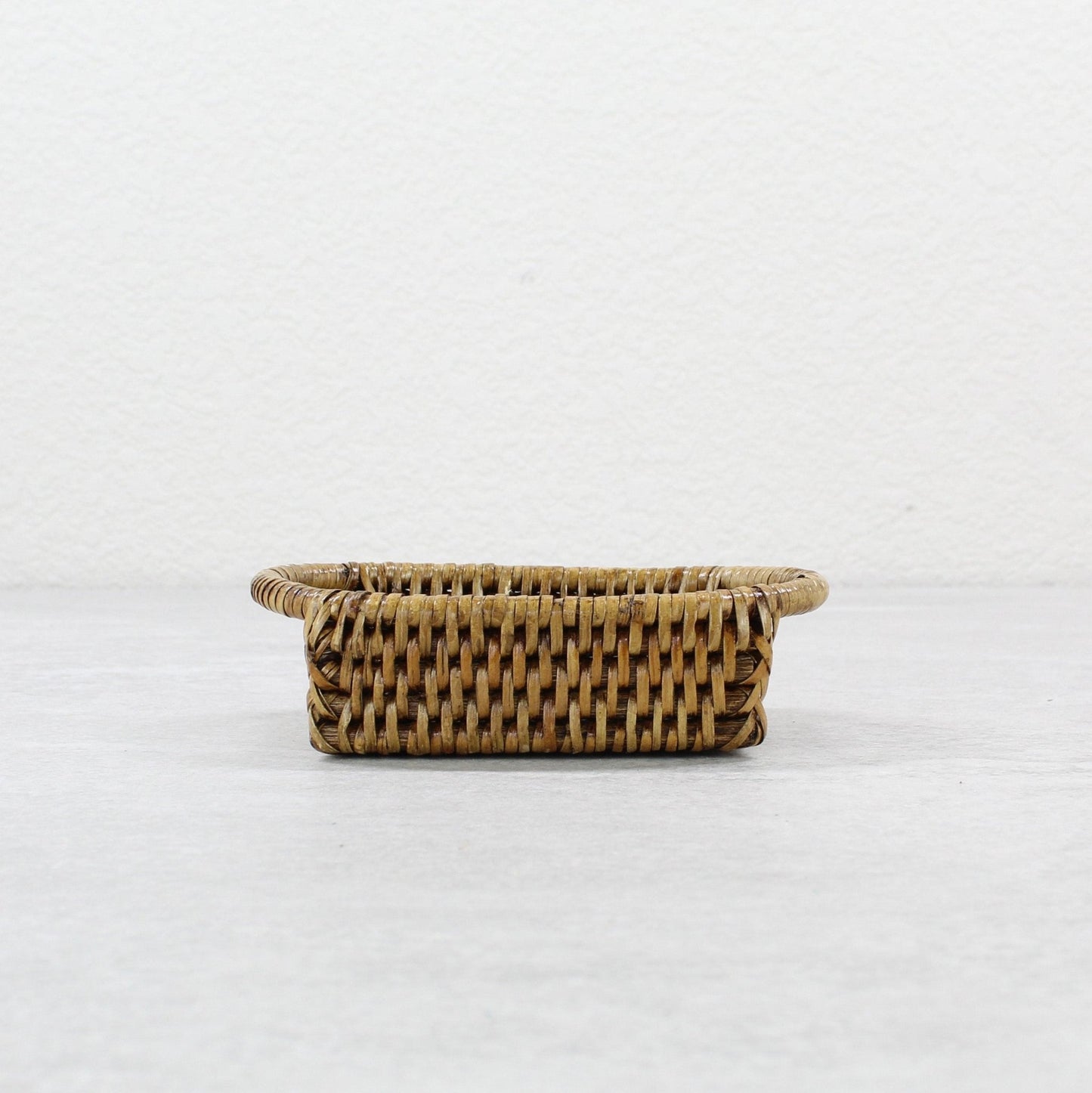 ECO HANDCRAFT brown mini rectangular rattan tray, handmade for spices, keys, or stylish countertop storage.