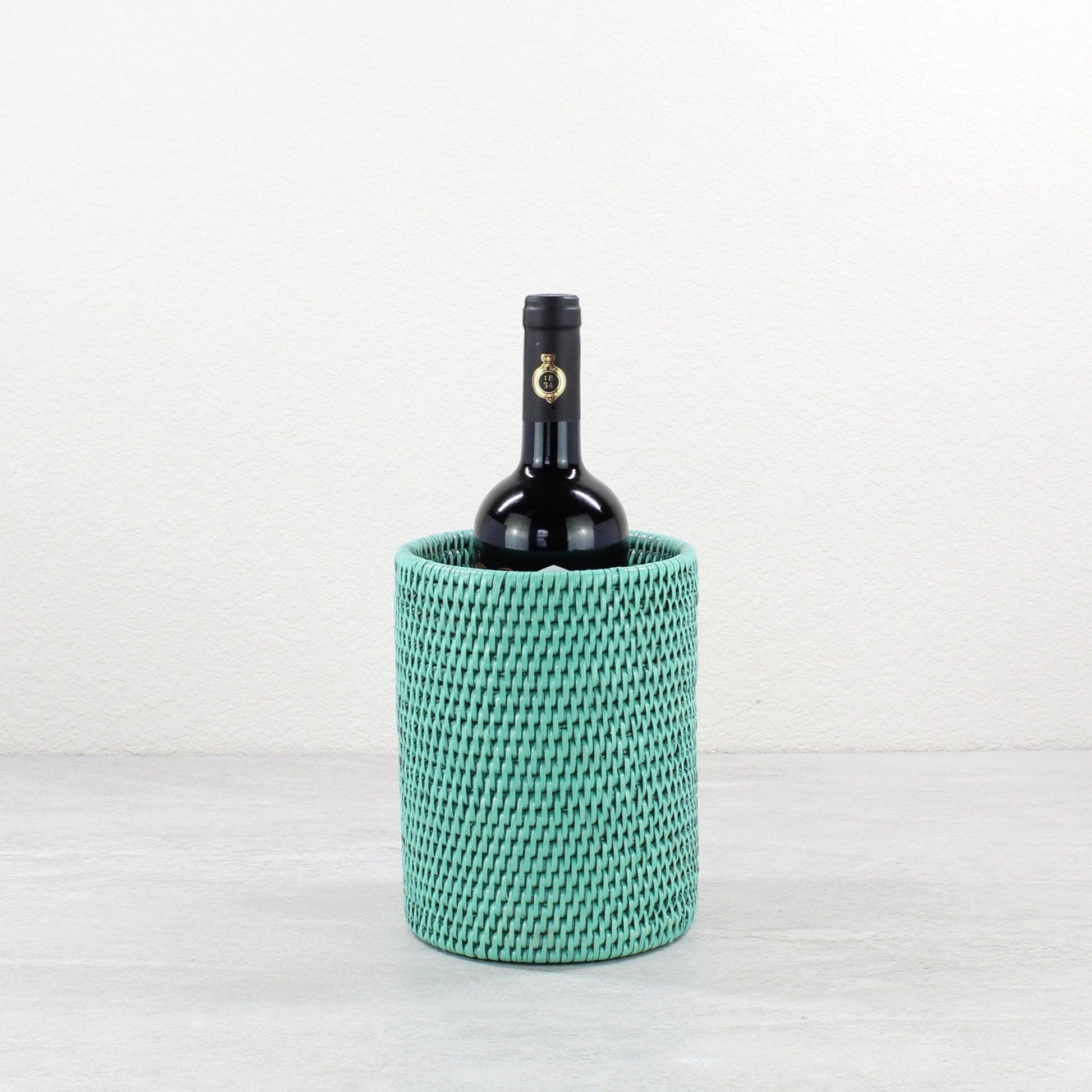 ECO HANDCRAFT turquoise woven rattan wine bottle holder, perfect for elegant, sustainable entertaining.