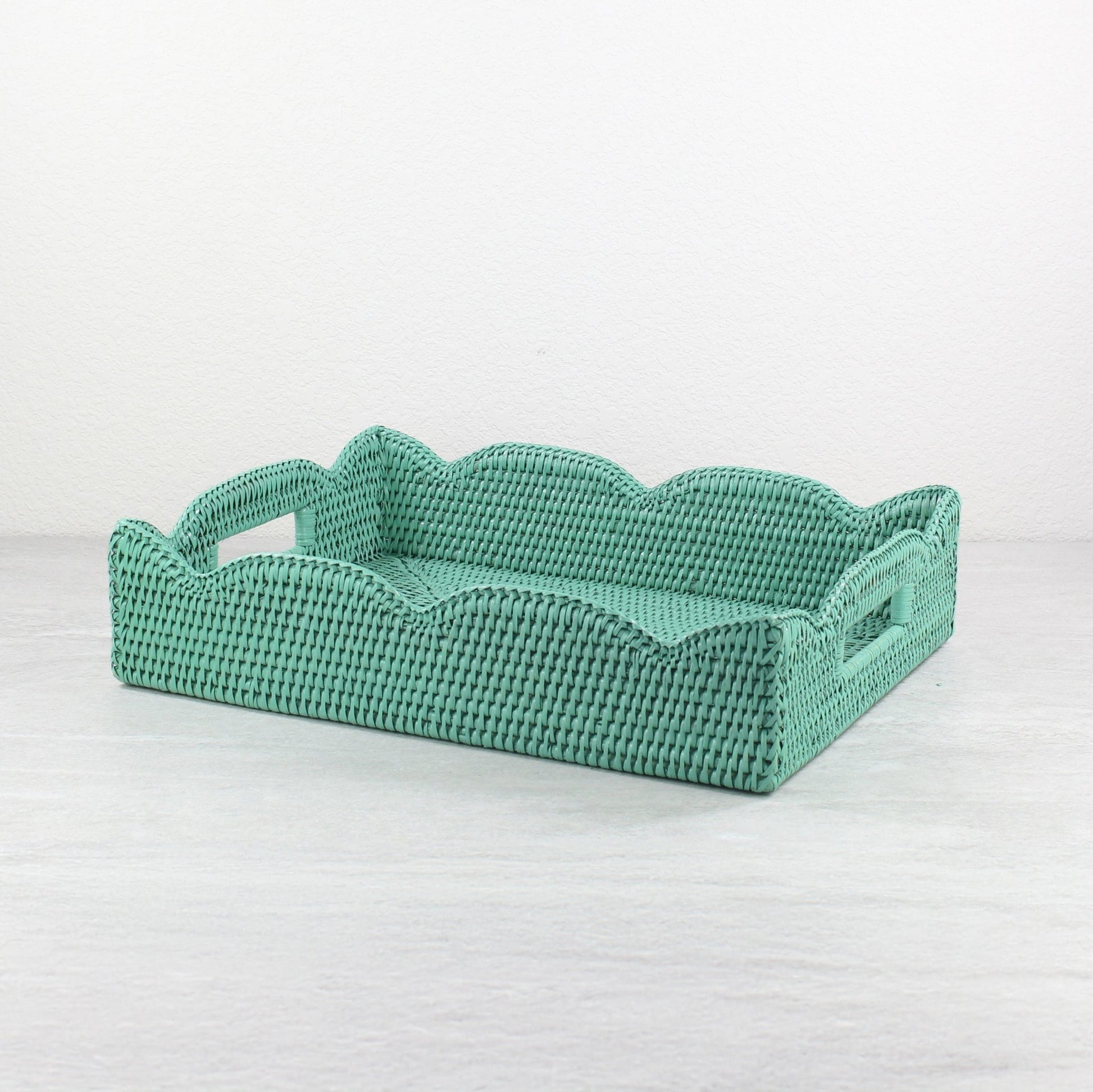 Handwoven scalloped rectangle rattan tray in turquoise, eco-friendly storage and serving tray with decorative wavy edges.