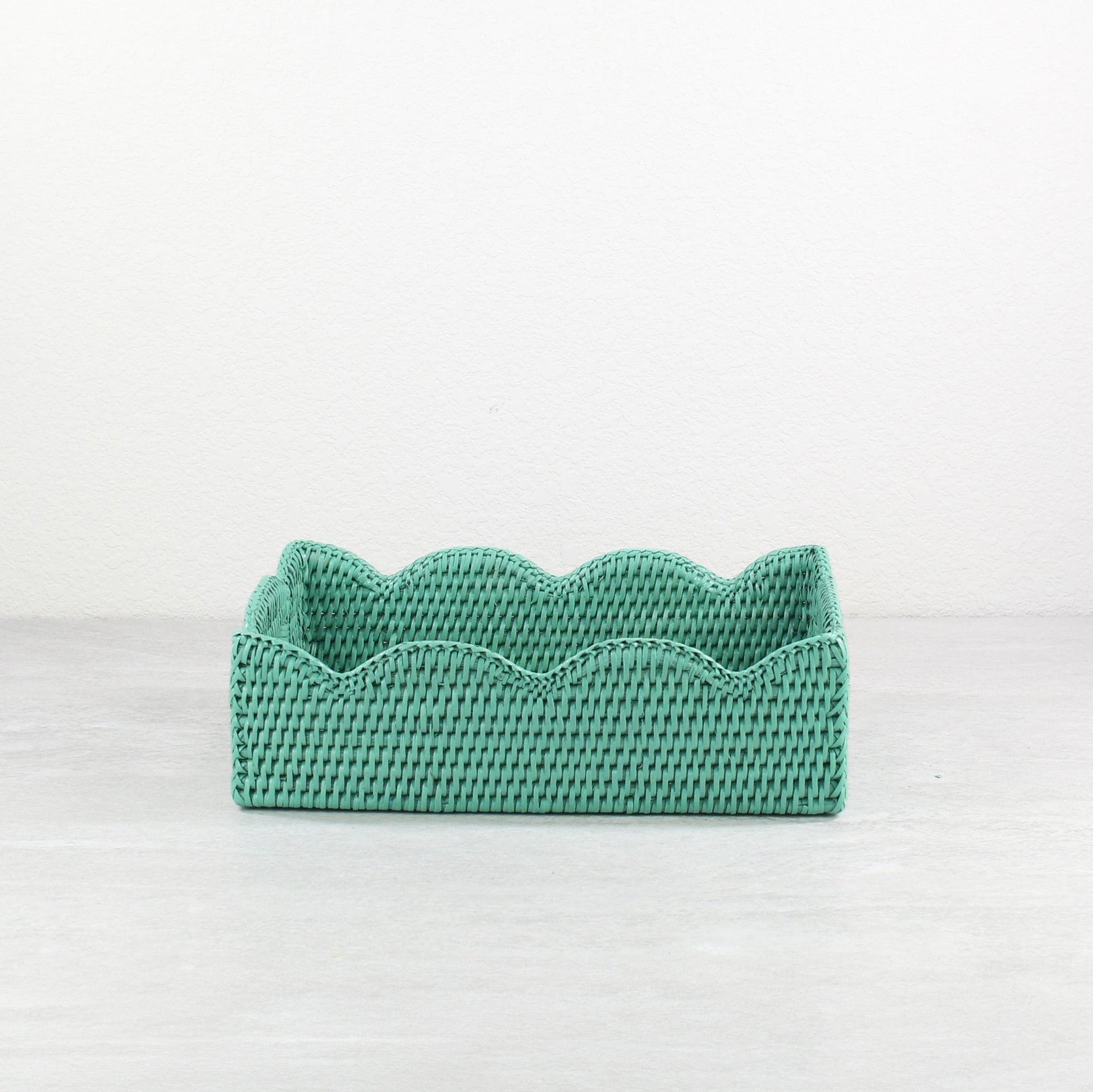 Front view of turquoise scalloped edge rattan tray, rectangular eco-friendly handmade tray with wavy decorative border.