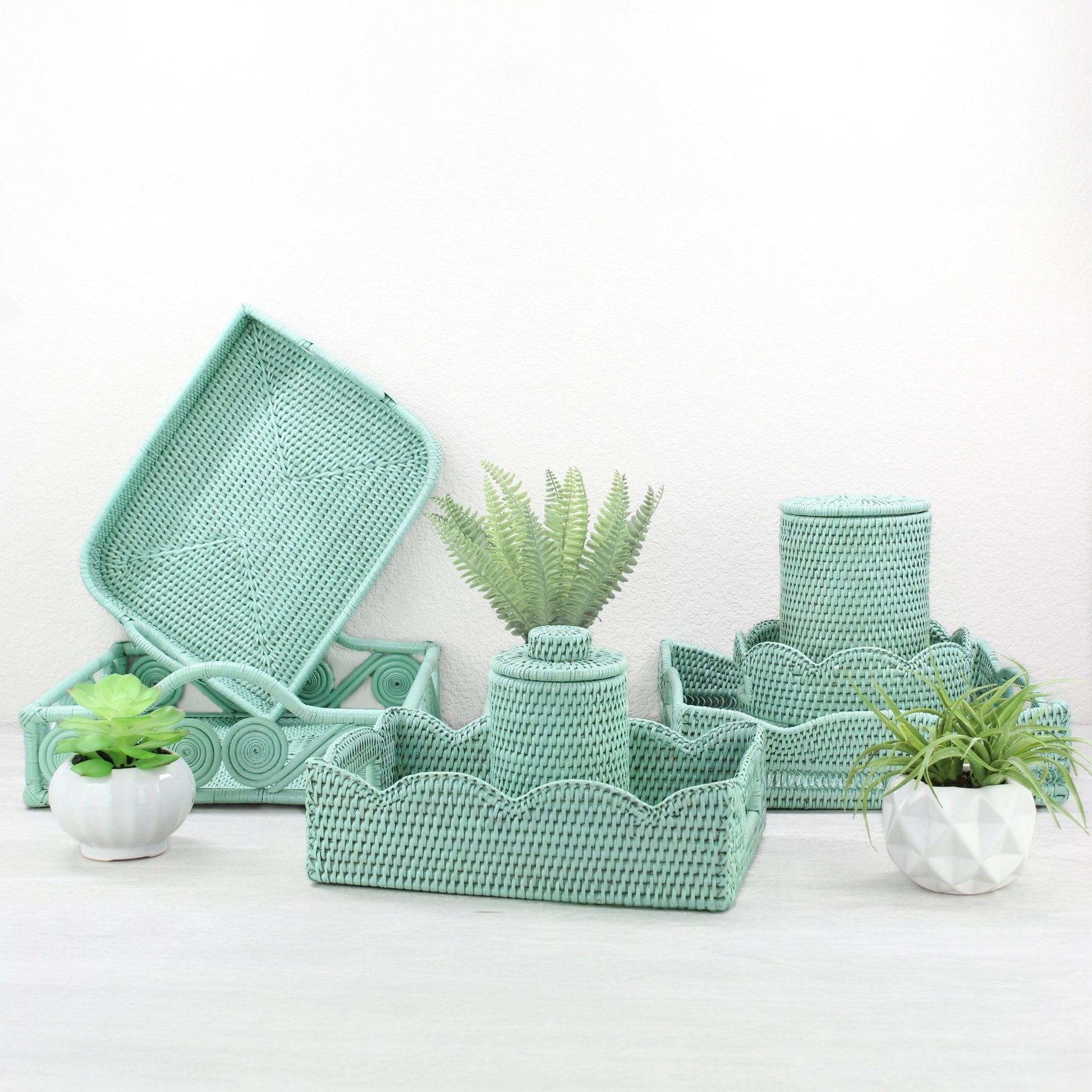 ECO HANDCRAFT sage leaf green rattan trays and bathroom canisters styled with plants for sustainable home décor inspiration