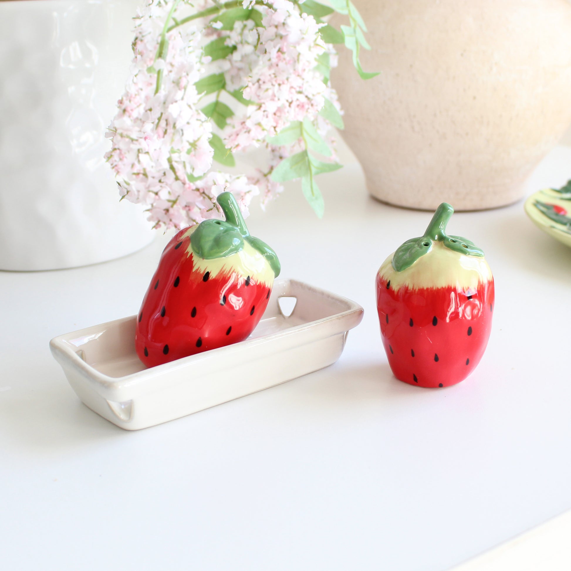 Strawberry-shaped ceramic salt and pepper shakers on tray, handpainted stoneware kitchen table décor