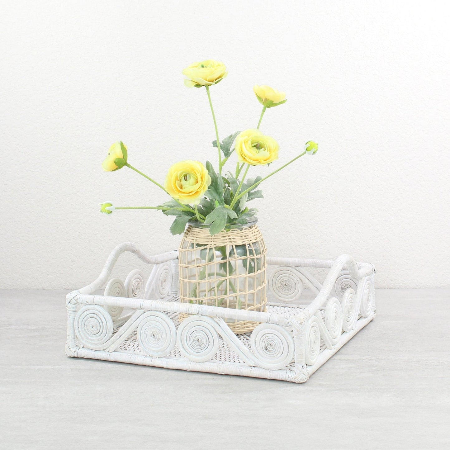 Eco Handcraft white spiral rattan tray styled with yellow flower vase – handmade, eco-luxe home decor accent